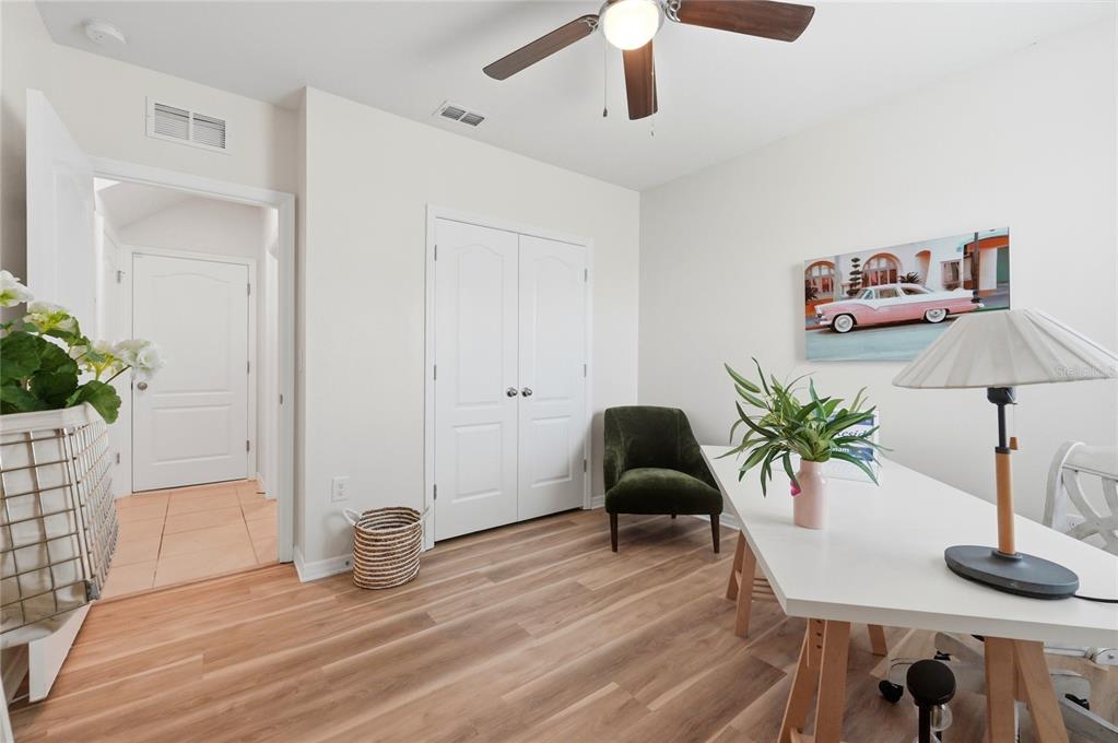 416 Corso Loop Winter Haven, FL 33884 - Photo 27 of 73 a living room with furniture and a potted plant