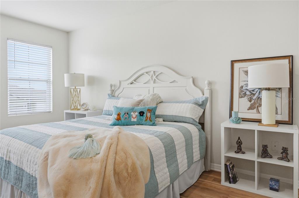 416 Corso Loop Winter Haven, FL 33884 - Photo 31 of 73 a bedroom with a bed and a window