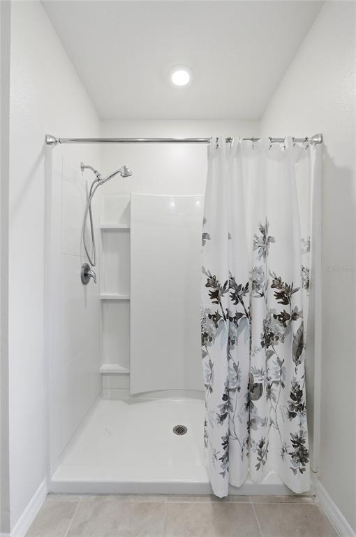 416 Corso Loop Winter Haven, FL 33884 - Photo 34 of 73 a bathroom with a shower and a shower