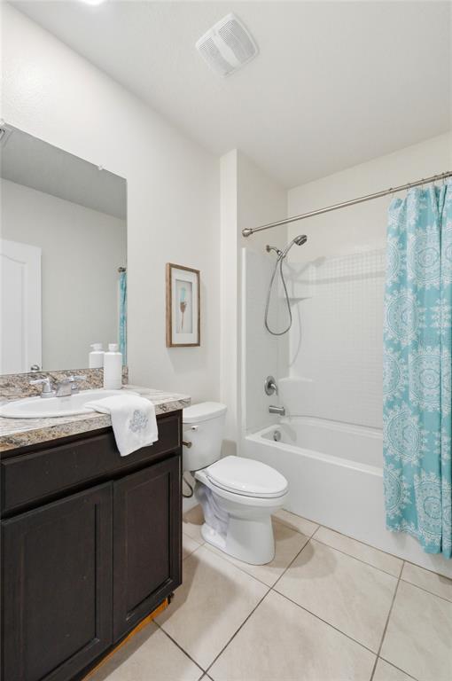 416 Corso Loop Winter Haven, FL 33884 - Photo 42 of 73 a bathroom with a granite countertop sink toilet mirror and bathtub