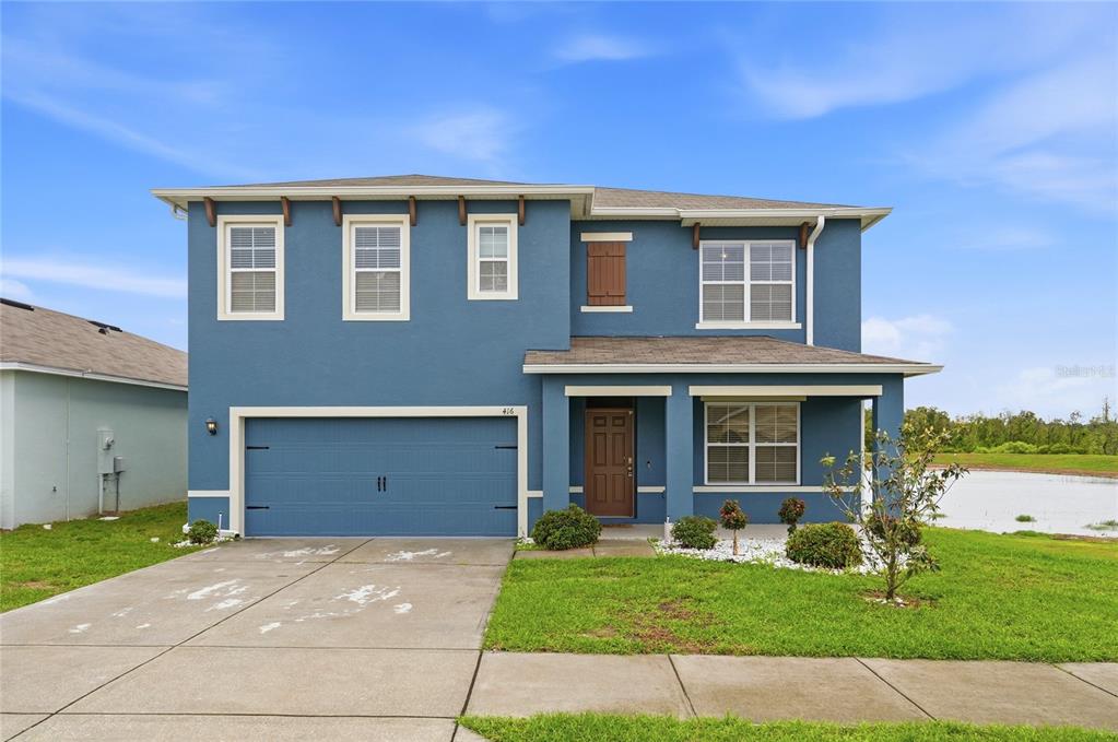 416 Corso Loop Winter Haven, FL 33884 - Photo 69 of 73 a view of a yard in front of a house