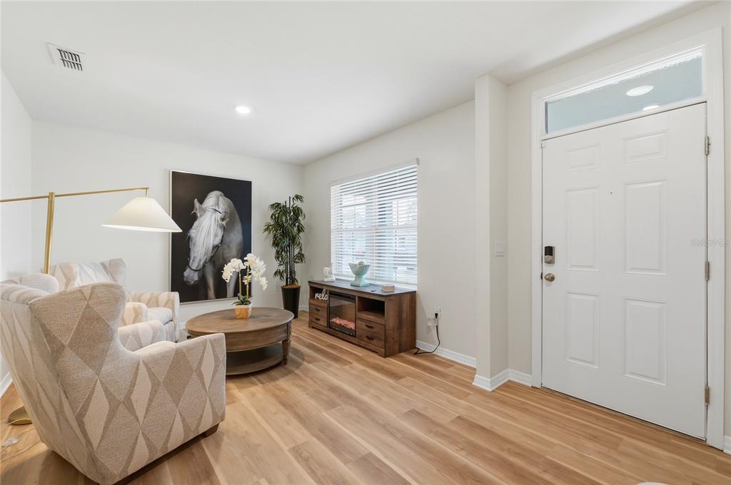 416 Corso Loop Winter Haven, FL 33884 - Photo 7 of 73 a living room with furniture and a window