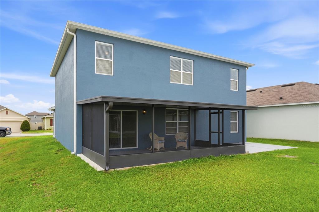 416 Corso Loop Winter Haven, FL 33884 - Photo 71 of 73 a view of an house with backyard space and balcony