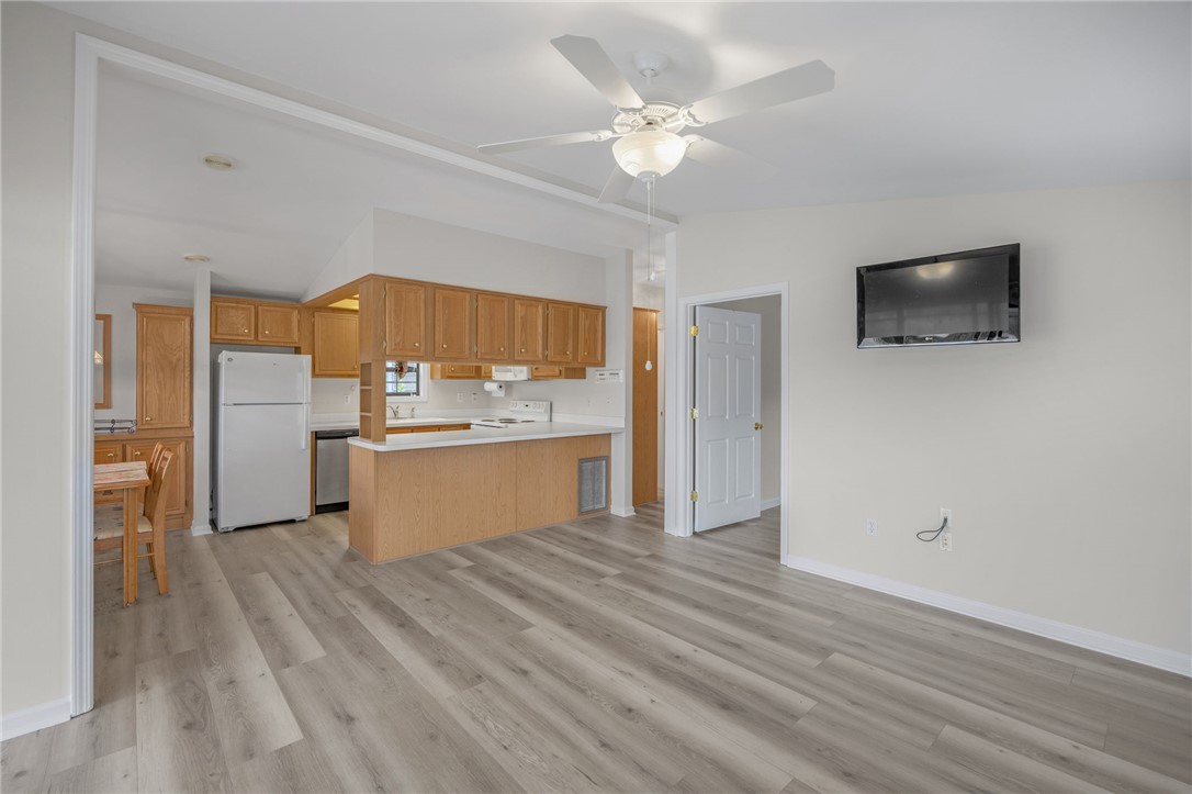 1230 Melton Road, Unit 25 West Union, SC 29696 - Photo 28 of 46 An open concept living area features resilient vinyl plank flooring and an inviting kitchen view.