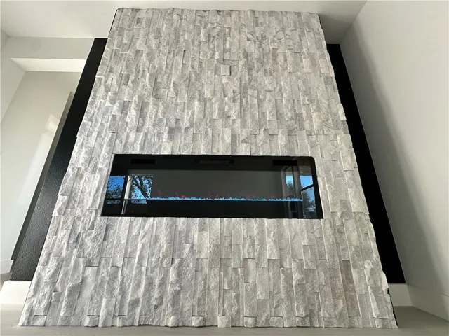 a kitchen with kitchen island white cabinets and white appliances