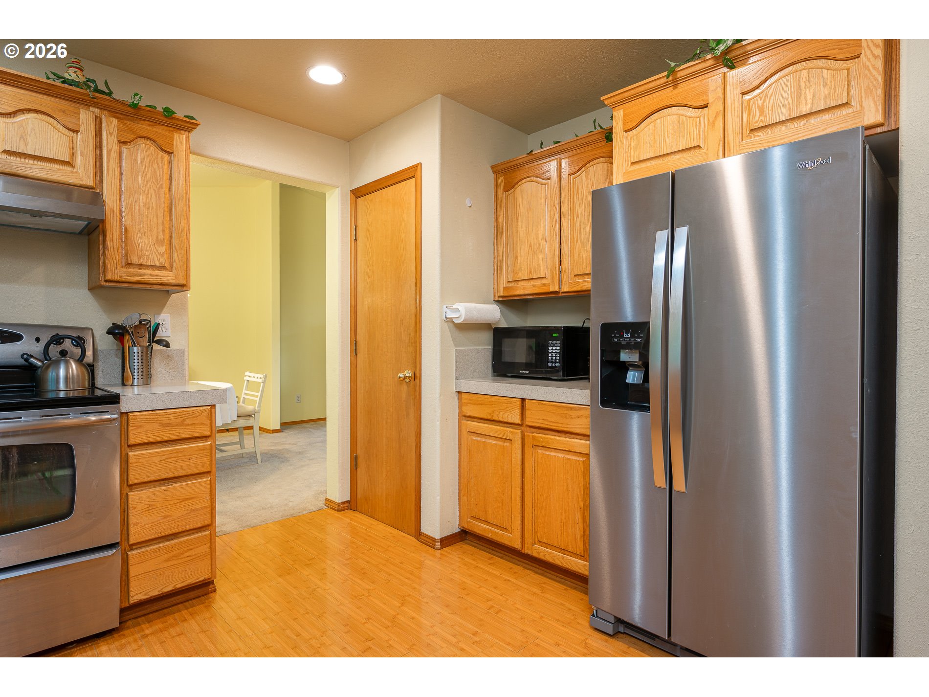 14300 Southeast Center Street Portland, OR 97236 - Photo 15 of 48 a kitchen with stainless steel appliances a refrigerator and a sink