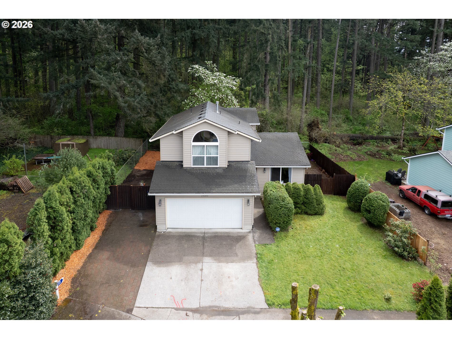 14300 Southeast Center Street Portland, OR 97236 - Photo 2 of 48 a front view of a house with a yard