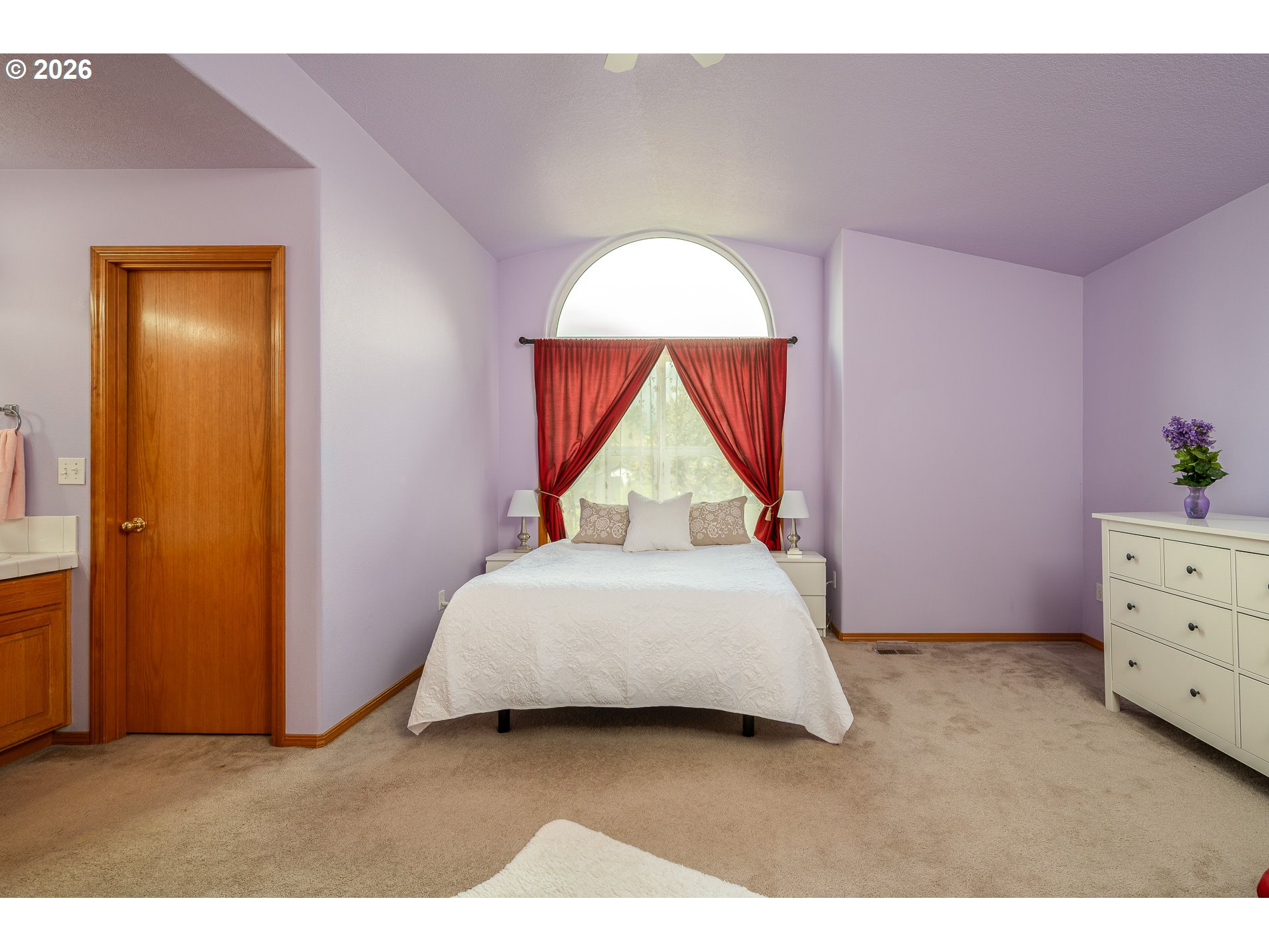 14300 Southeast Center Street Portland, OR 97236 - Photo 21 of 48 a bedroom with a bed and a potted plant