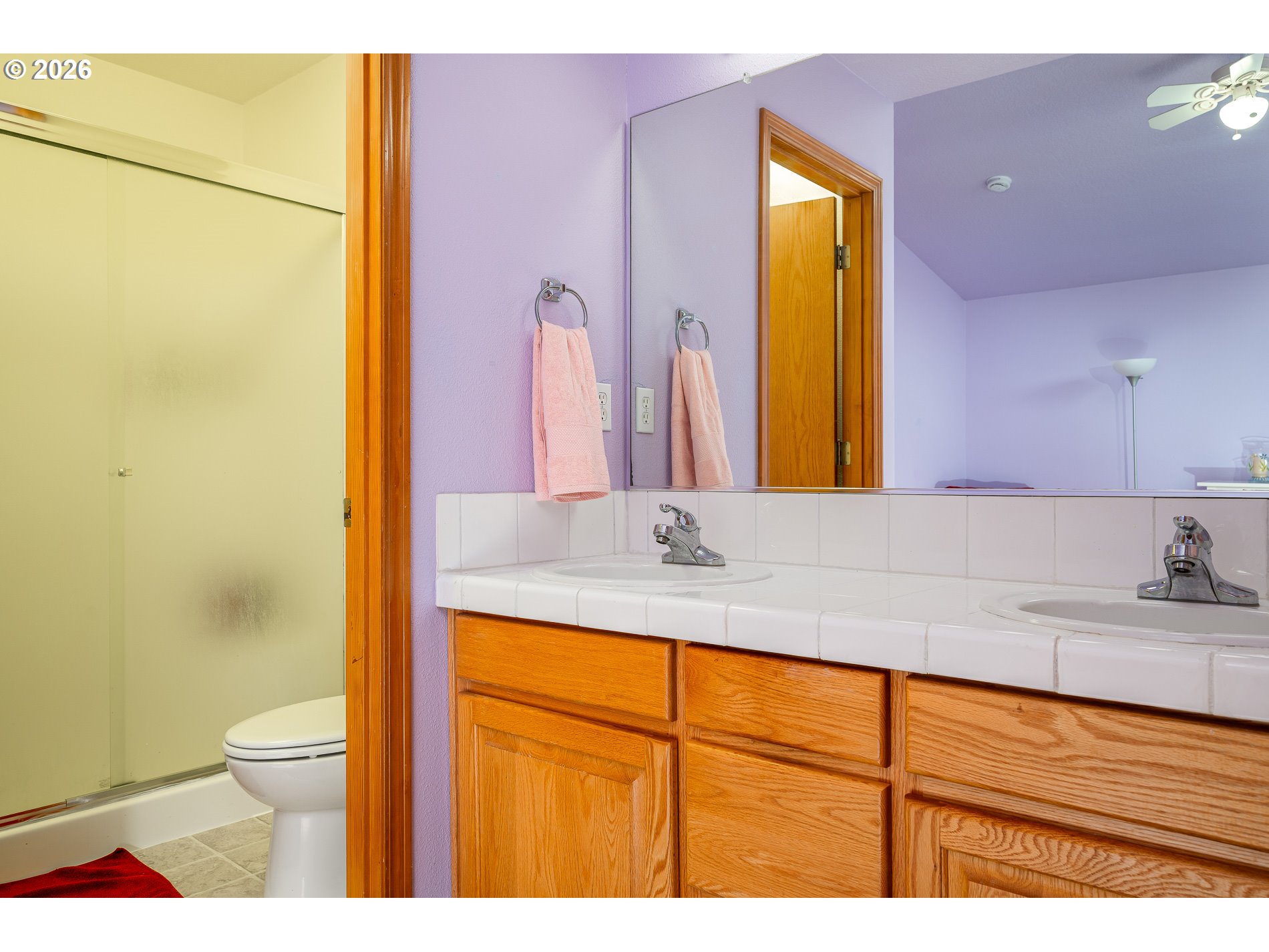 14300 Southeast Center Street Portland, OR 97236 - Photo 24 of 48 a bathroom with a granite countertop sink mirror vanity and toilet