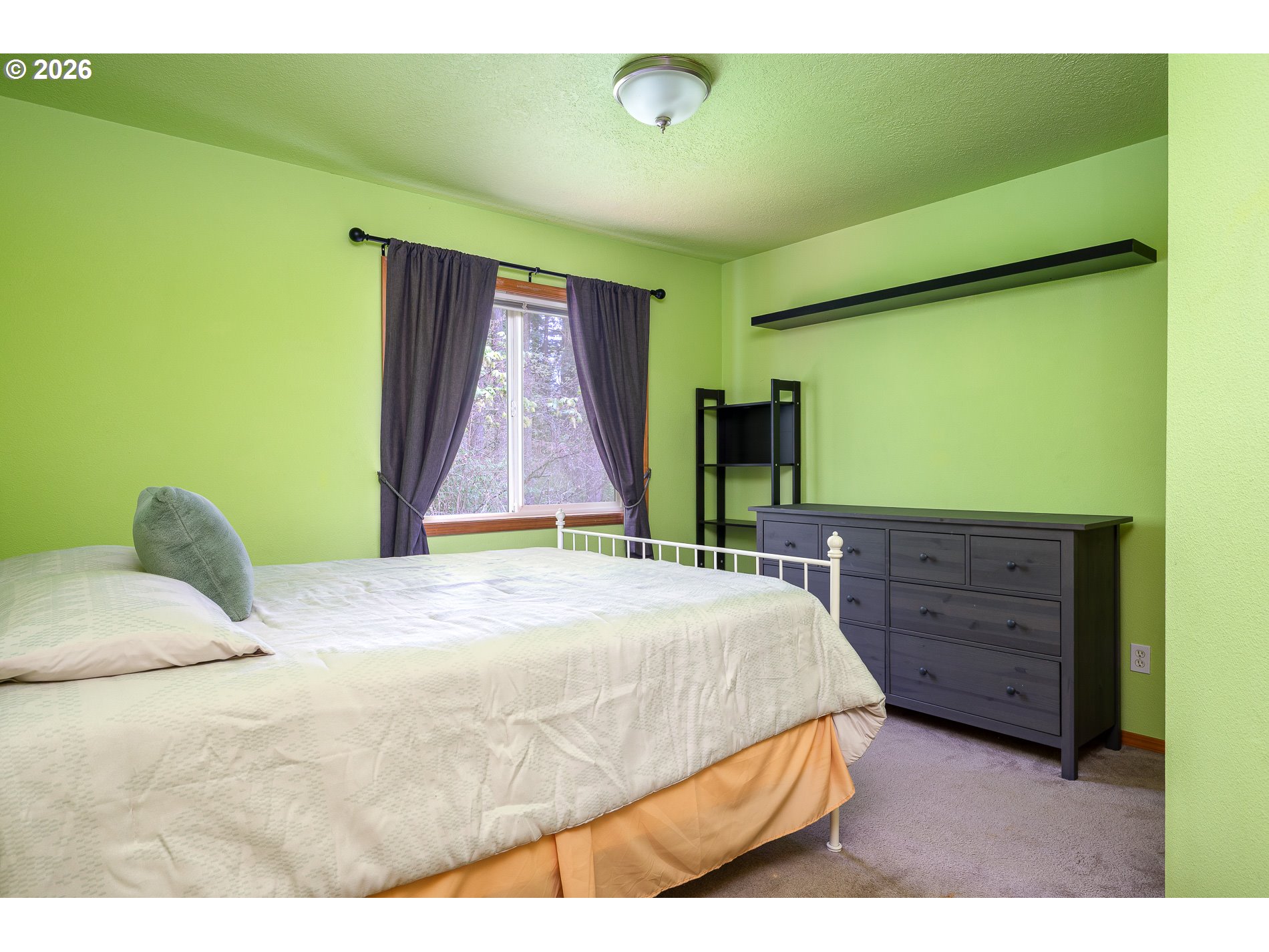 14300 Southeast Center Street Portland, OR 97236 - Photo 25 of 48 a bedroom with a bed and a dresser