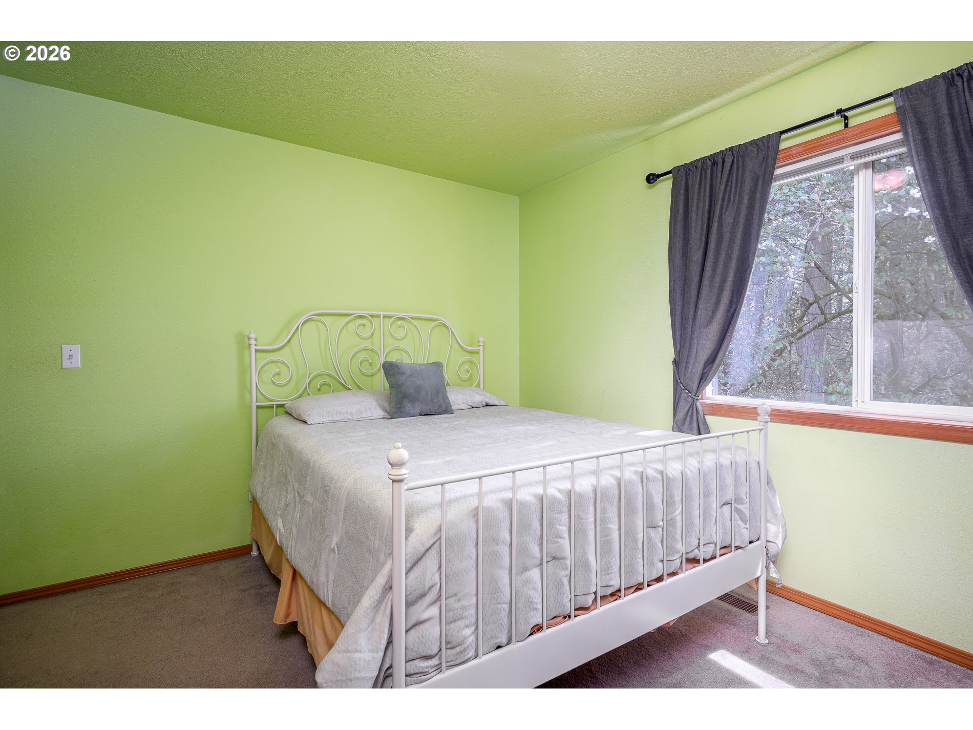 14300 Southeast Center Street Portland, OR 97236 - Photo 26 of 48 a bedroom with a bed and a window