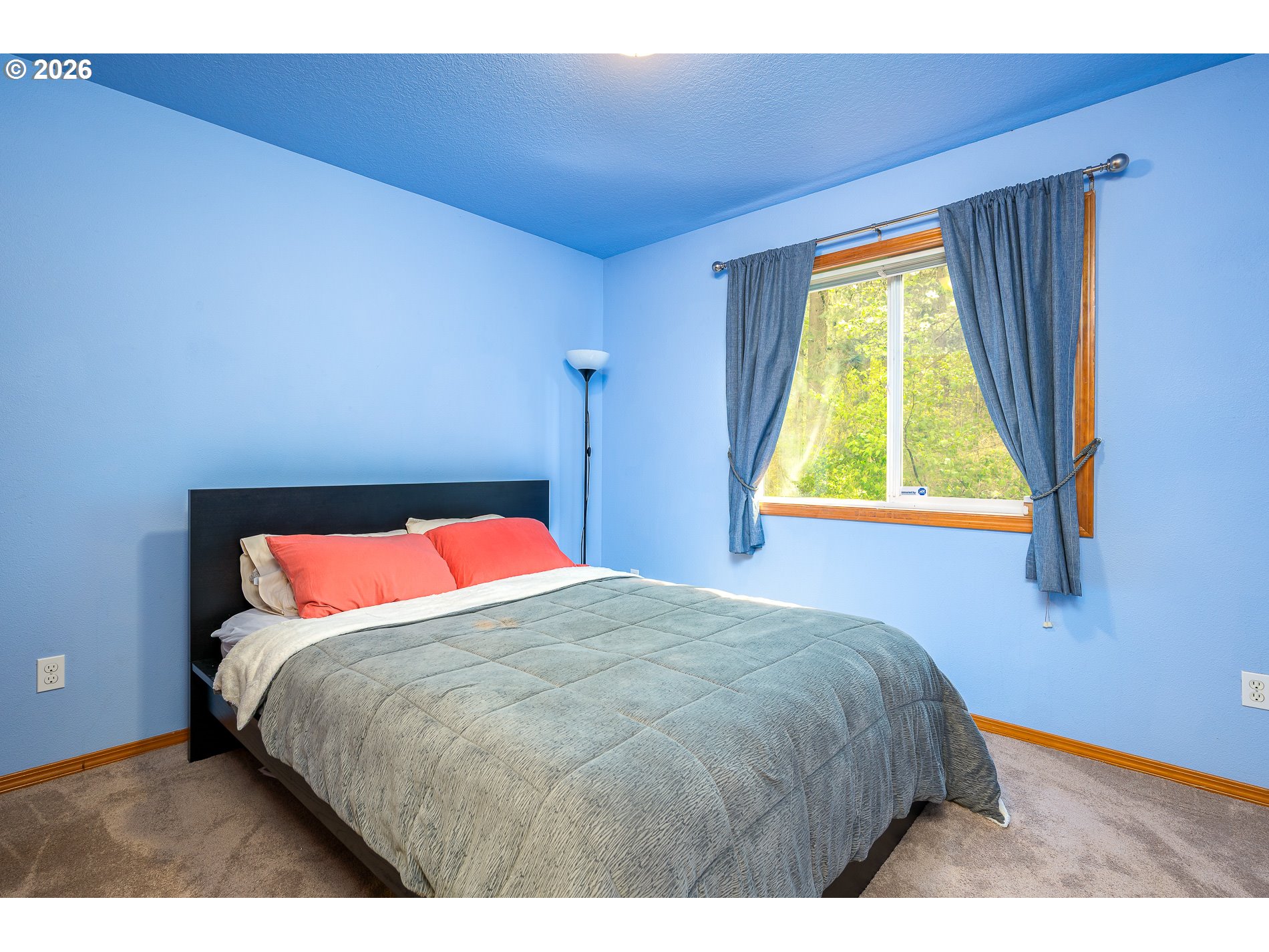 14300 Southeast Center Street Portland, OR 97236 - Photo 28 of 48 a bedroom with a bed and a window