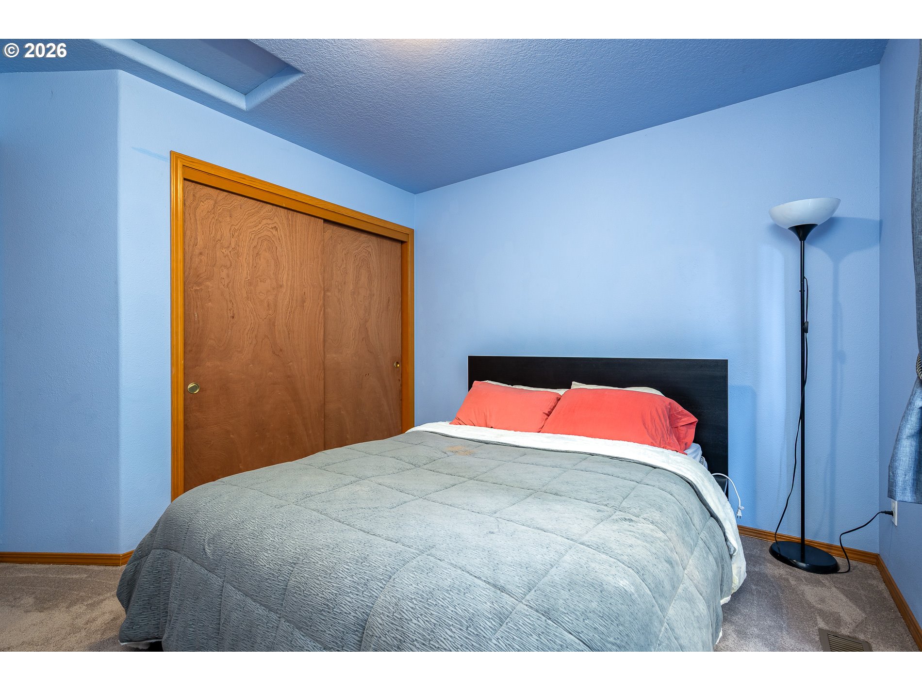 14300 Southeast Center Street Portland, OR 97236 - Photo 29 of 48 a bedroom with a bed and a dresser