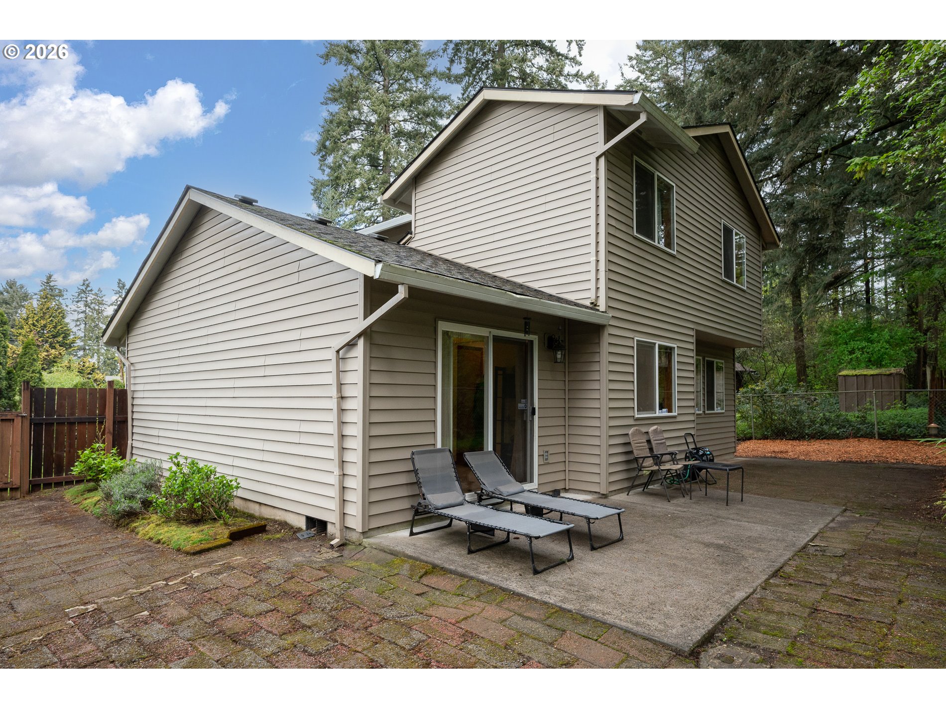 14300 Southeast Center Street Portland, OR 97236 - Photo 36 of 48 a backyard of a house with yard table and chairs