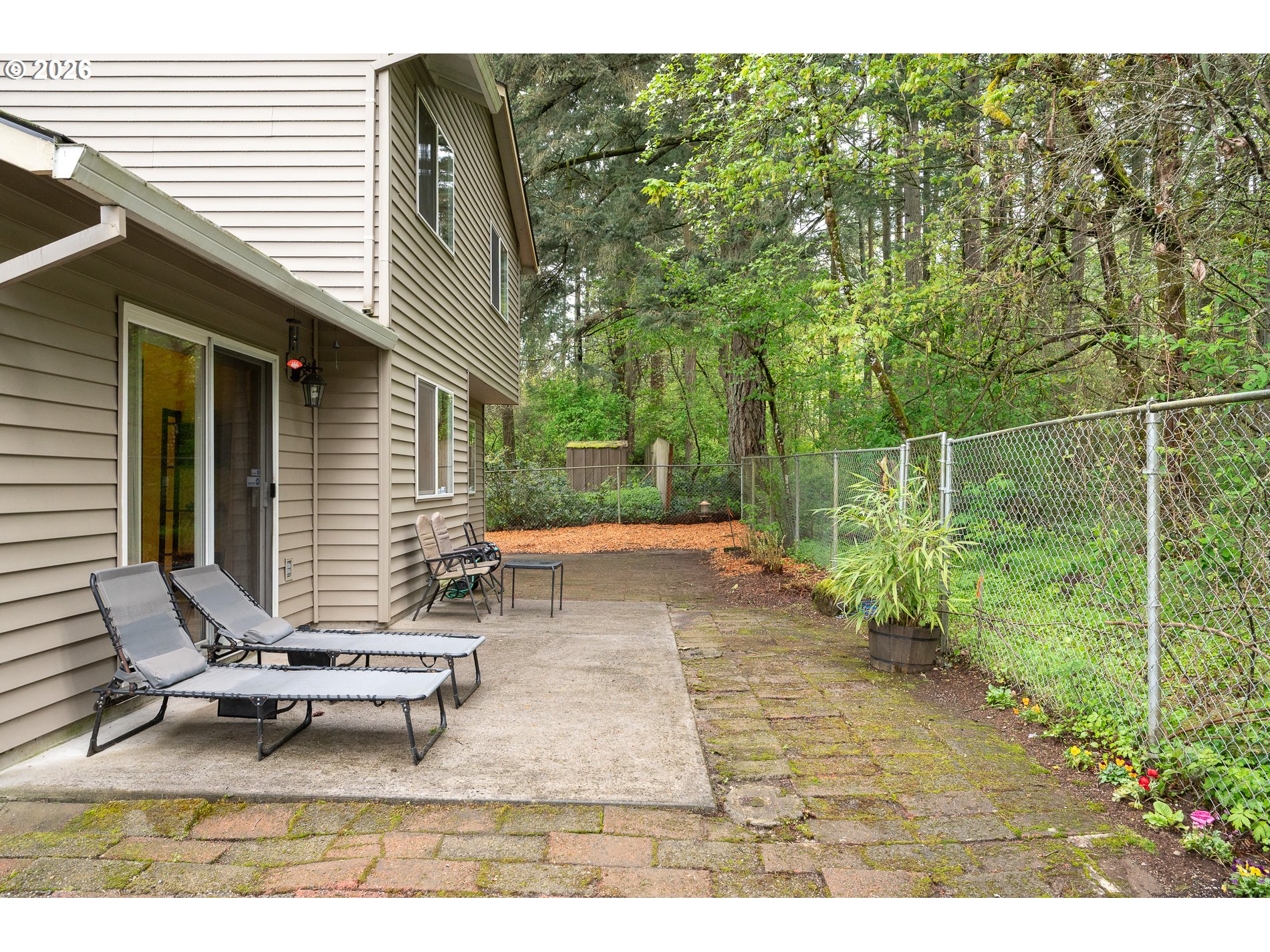14300 Southeast Center Street Portland, OR 97236 - Photo 37 of 48 a backyard of a house with table and chairs