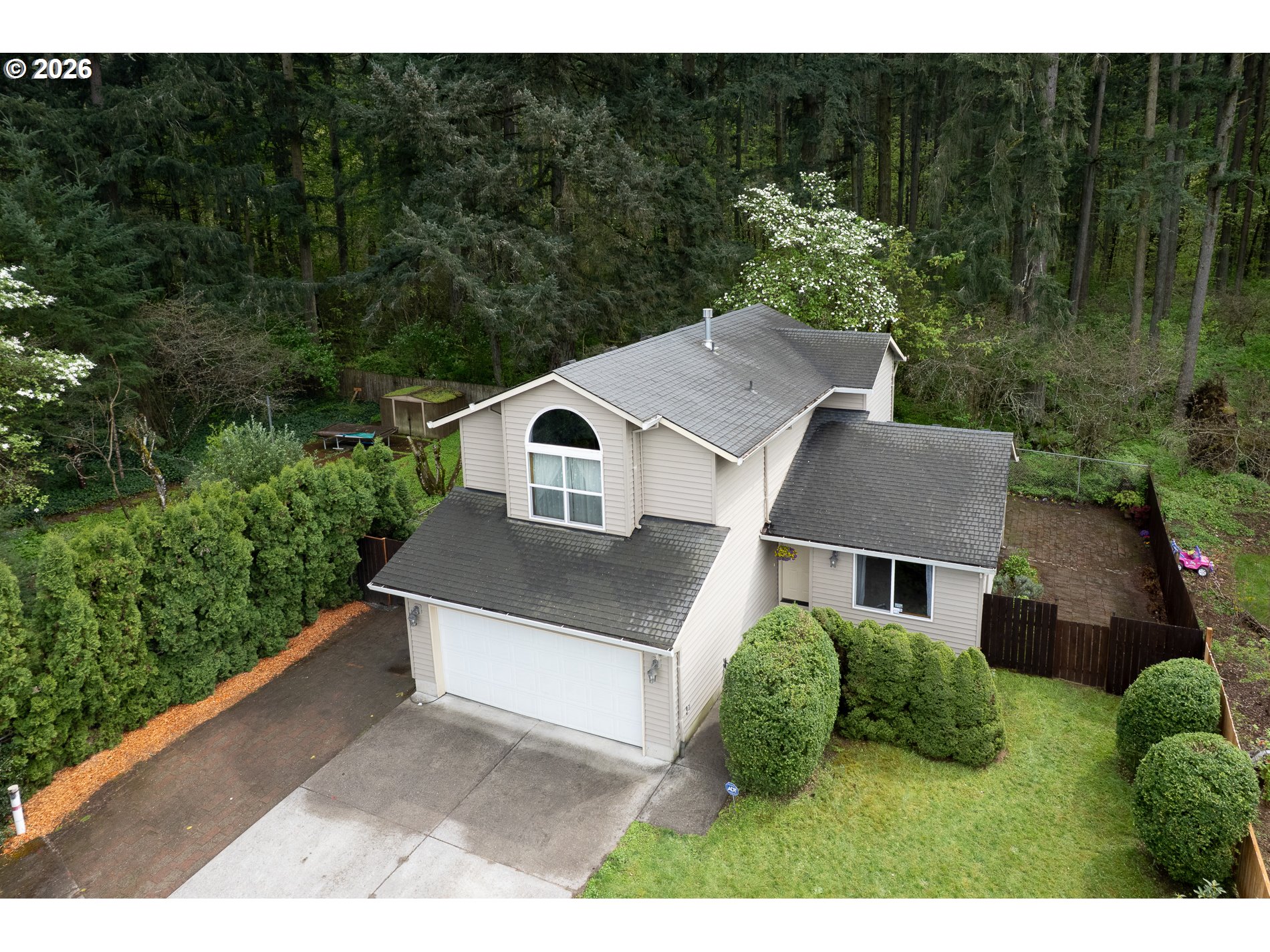 14300 Southeast Center Street Portland, OR 97236 - Photo 4 of 48 a aerial view of a house with yard and outdoor seating