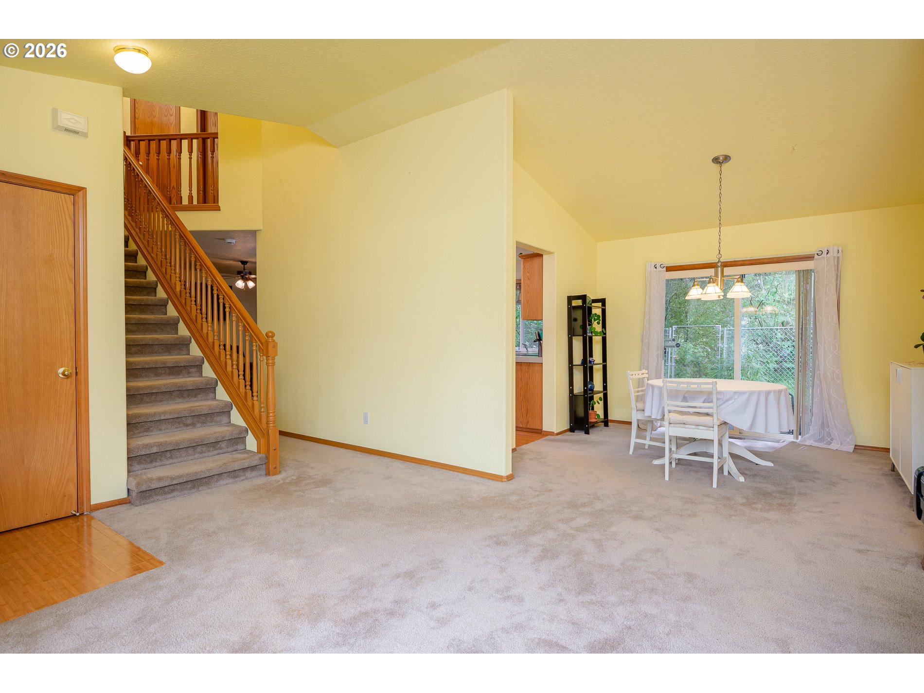 14300 Southeast Center Street Portland, OR 97236 - Photo 6 of 48 a view of an empty room with stairs and a window