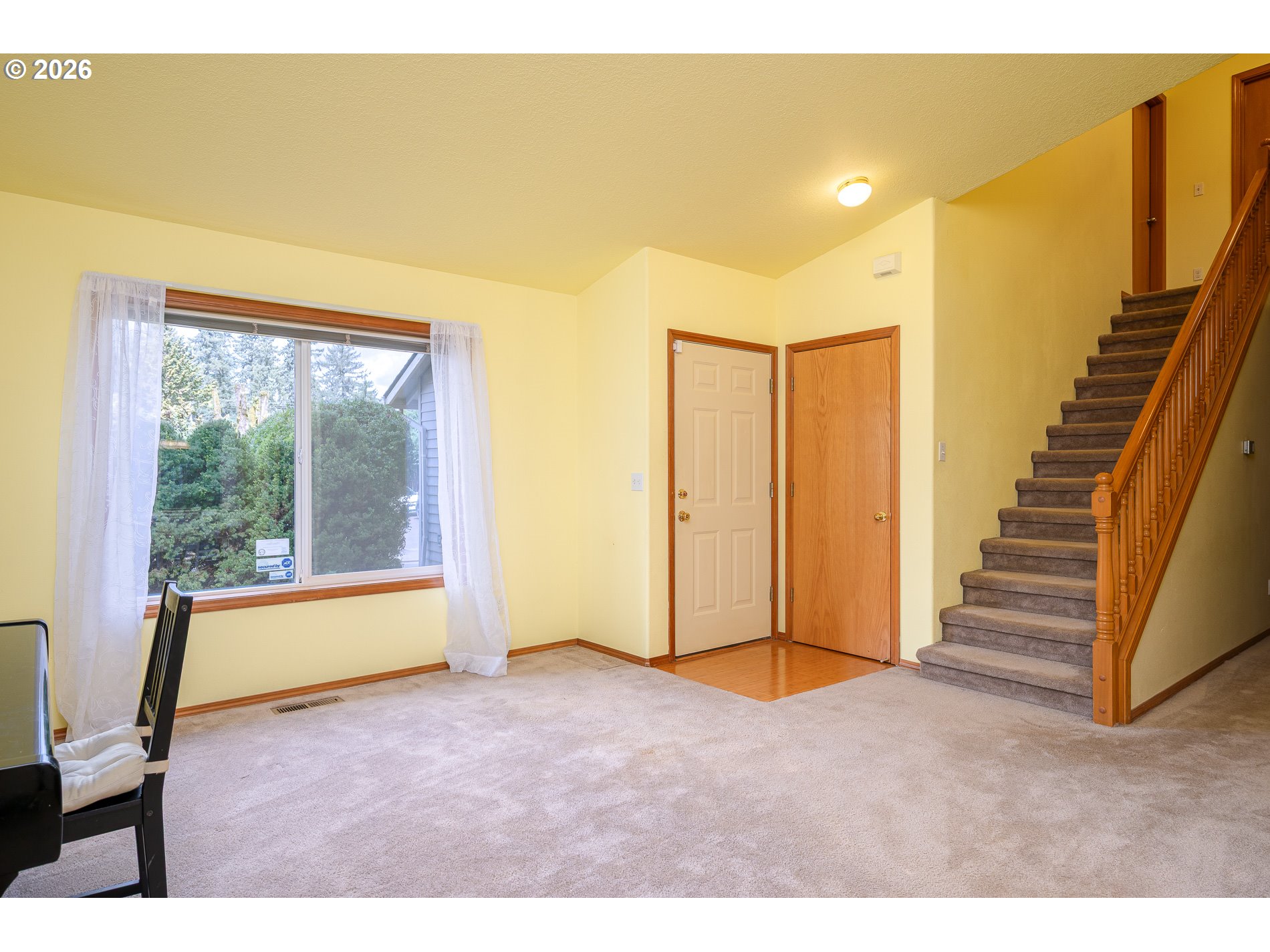 14300 Southeast Center Street Portland, OR 97236 - Photo 8 of 48 a view of an empty room with a window