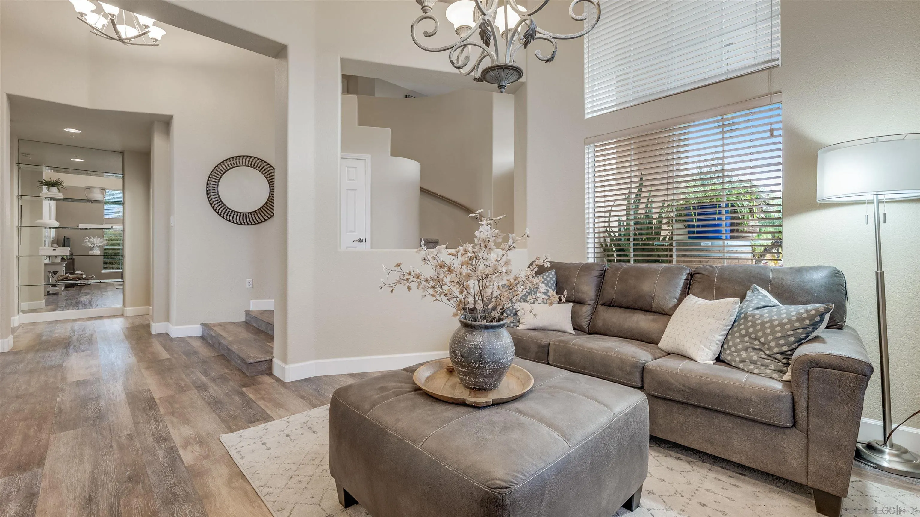 2352 Rock Crest Glen Escondido, CA 92026 - Photo 16 of 48 a living room with furniture chandelier and a window