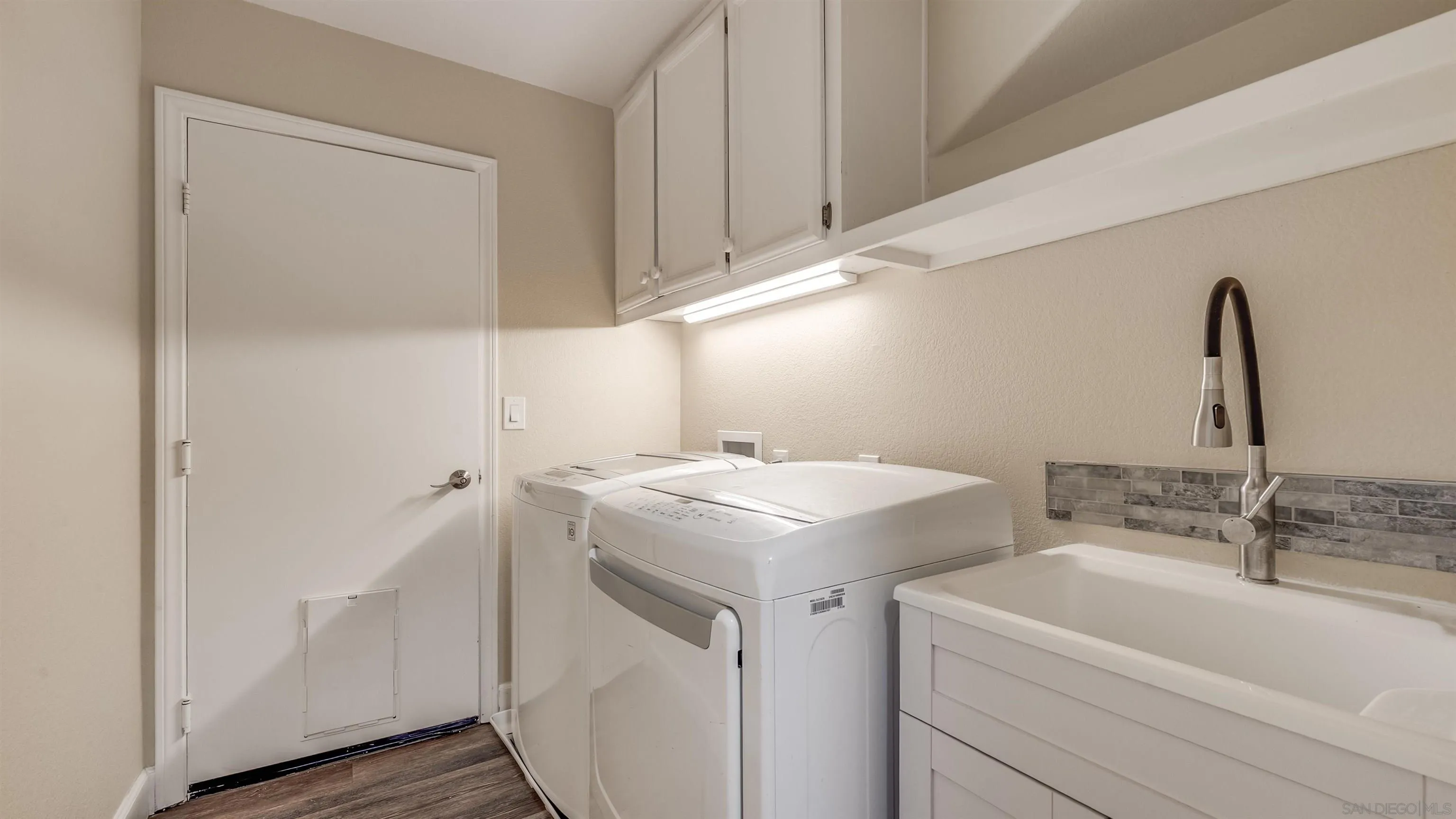 2352 Rock Crest Glen Escondido, CA 92026 - Photo 24 of 48 a utility room with cabinets