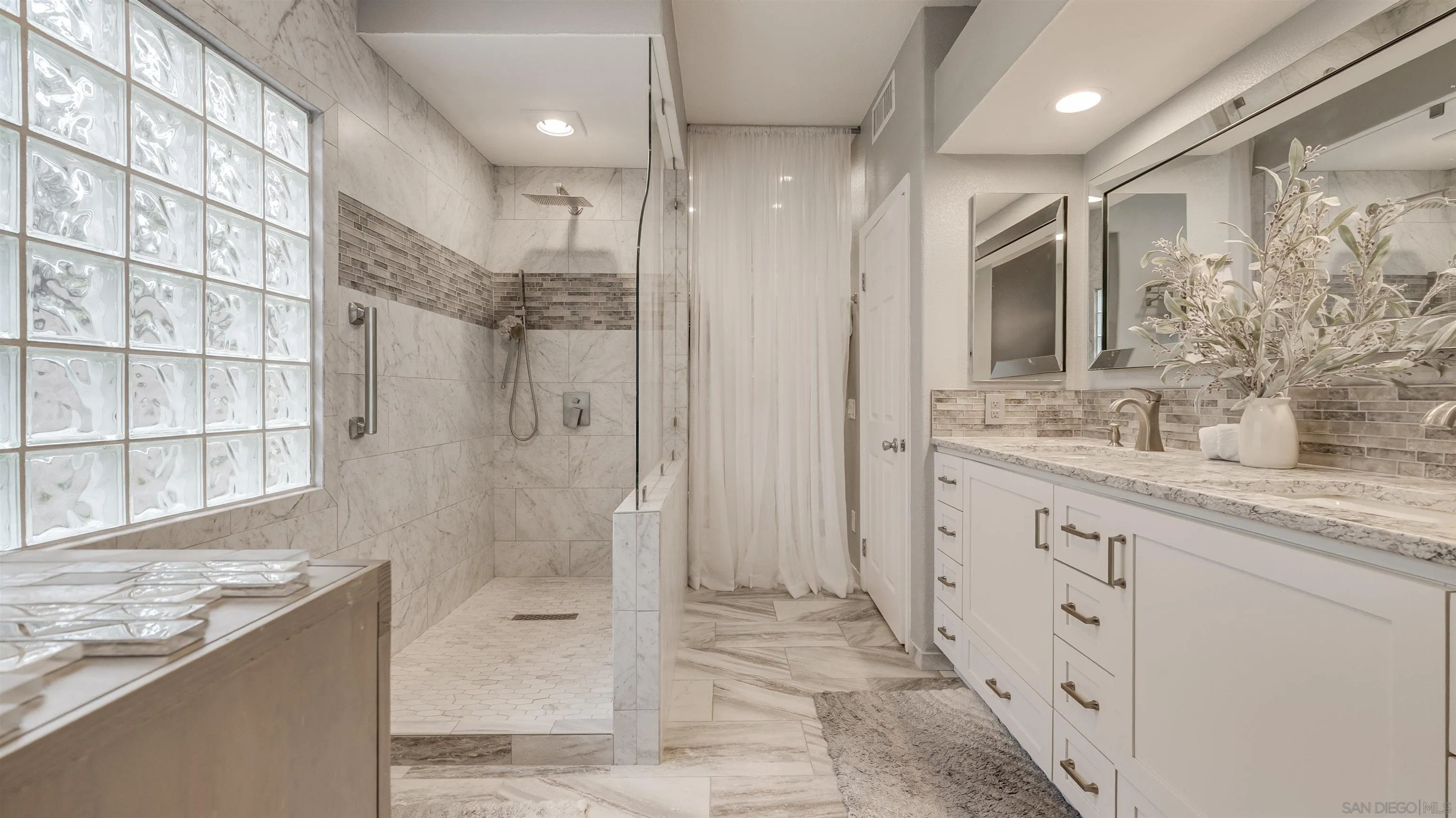 2352 Rock Crest Glen Escondido, CA 92026 - Photo 25 of 48 a bathroom with a granite countertop sink mirror and shower