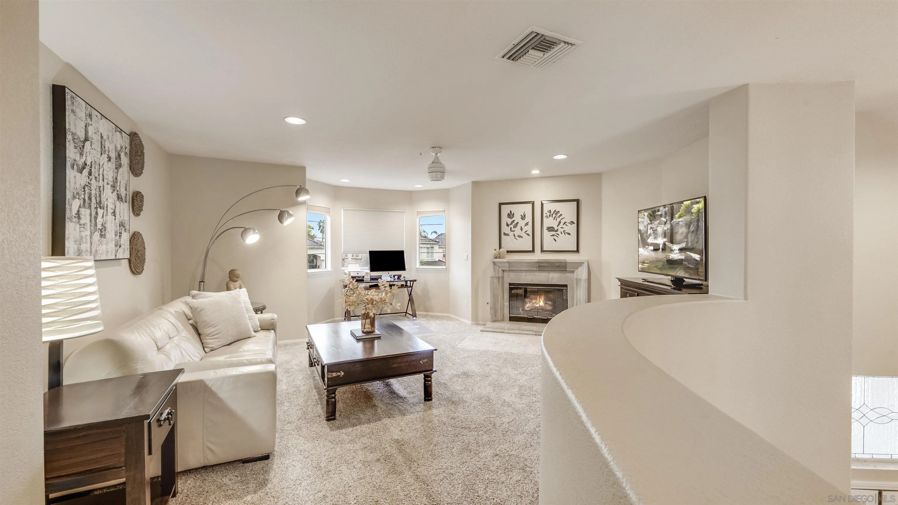 2352 Rock Crest Glen Escondido, CA 92026 - Photo 27 of 48 a living room with furniture a table and a painting