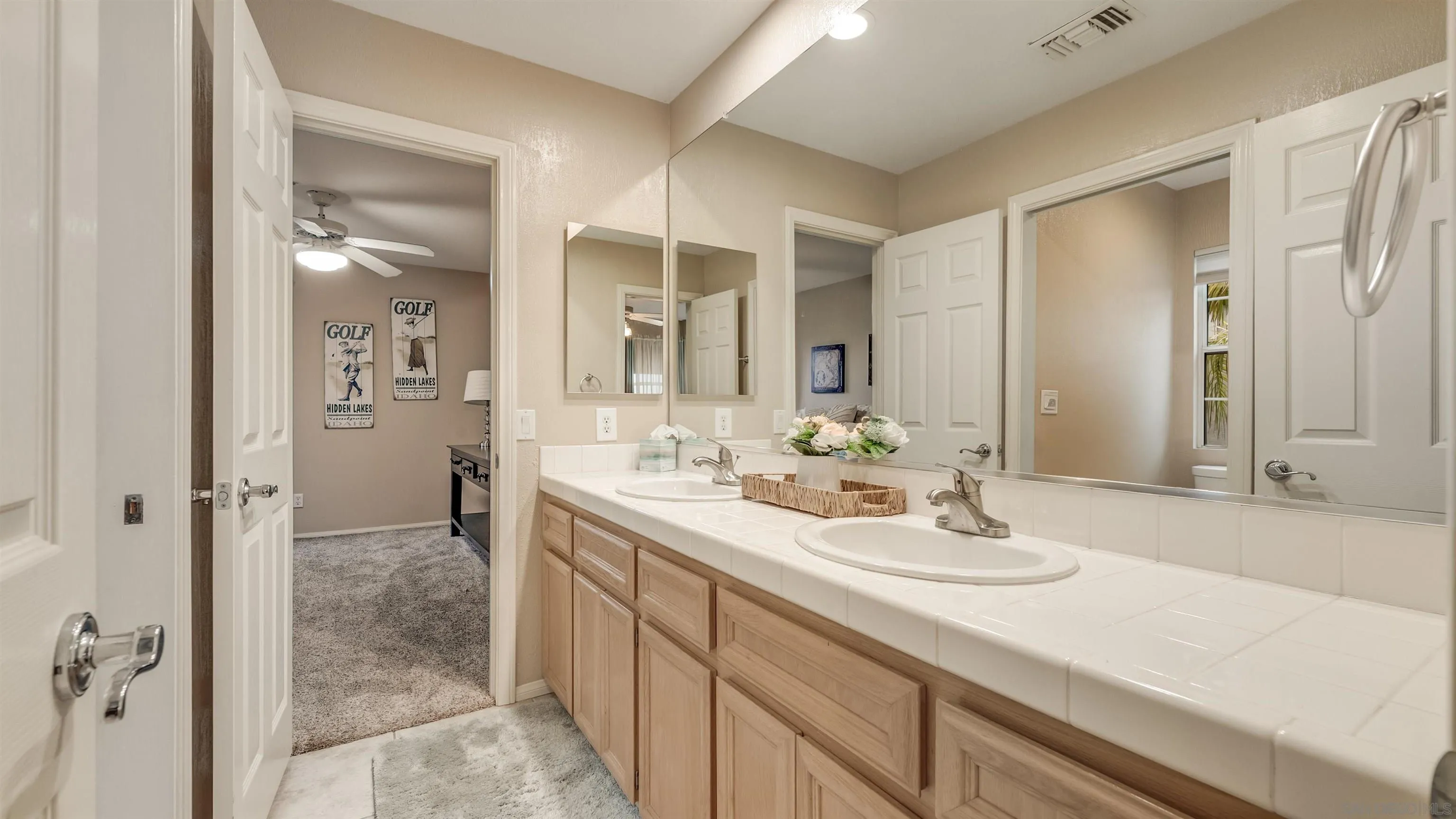 2352 Rock Crest Glen Escondido, CA 92026 - Photo 31 of 48 a bathroom with a sink shower and a mirror