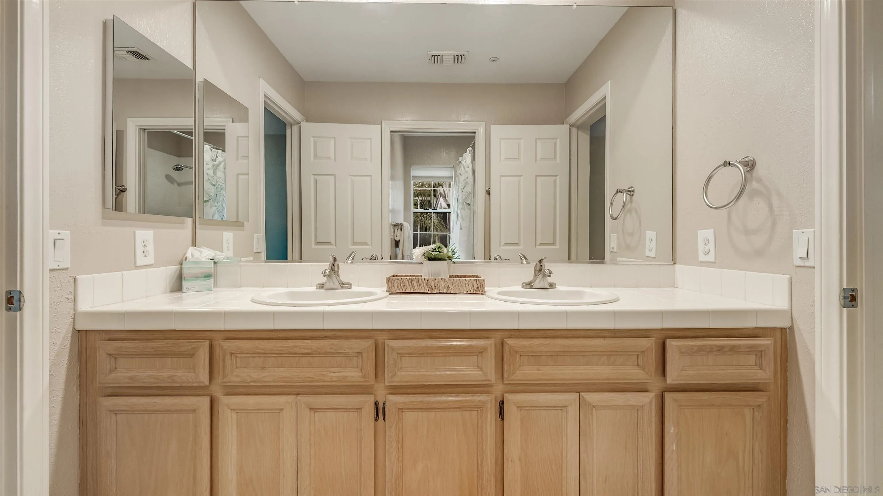 2352 Rock Crest Glen Escondido, CA 92026 - Photo 32 of 48 a bathroom with a sink and a mirror