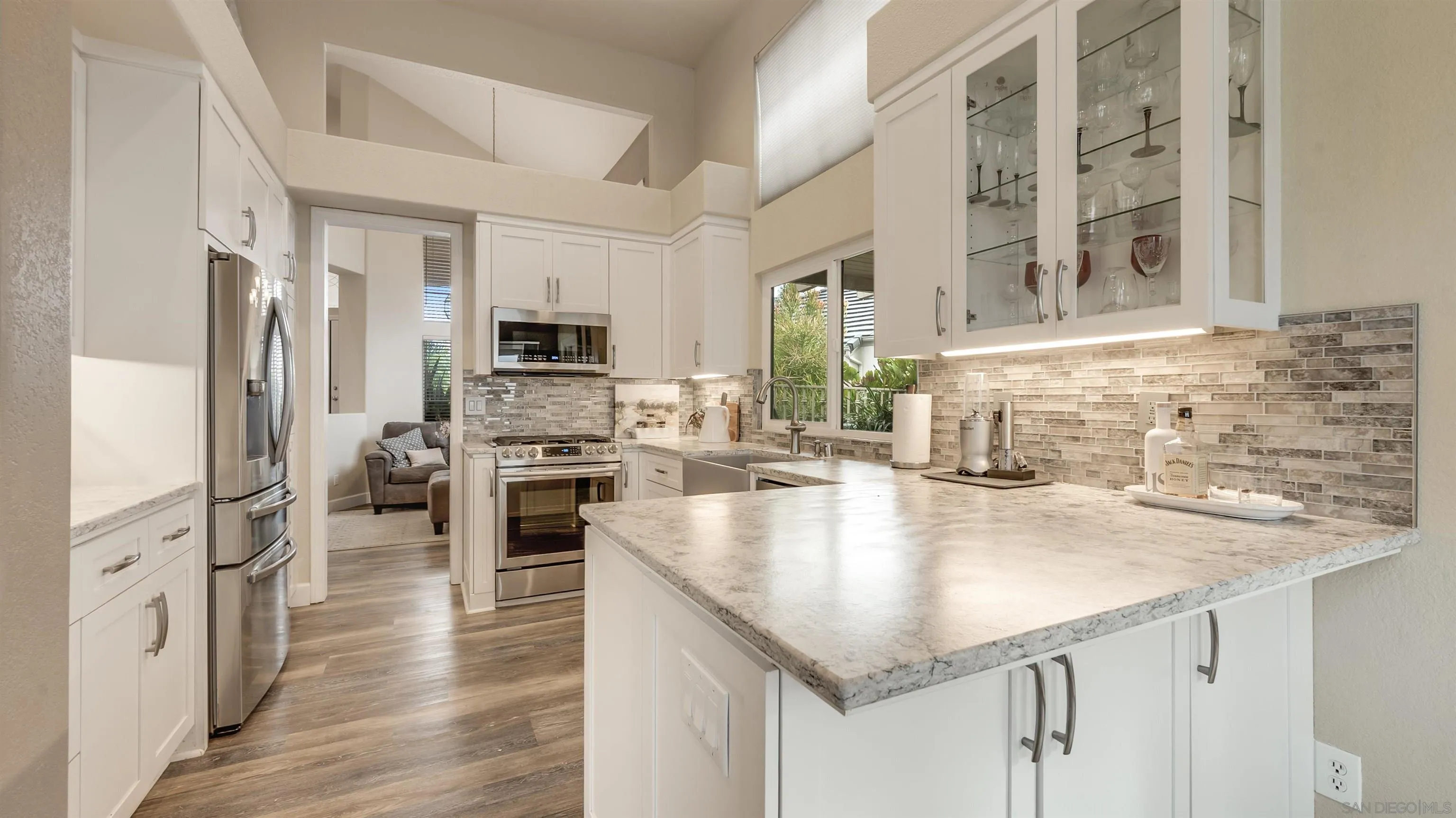 2352 Rock Crest Glen Escondido, CA 92026 - Photo 9 of 48 a kitchen with stainless steel appliances granite countertop a sink a stove and microwave