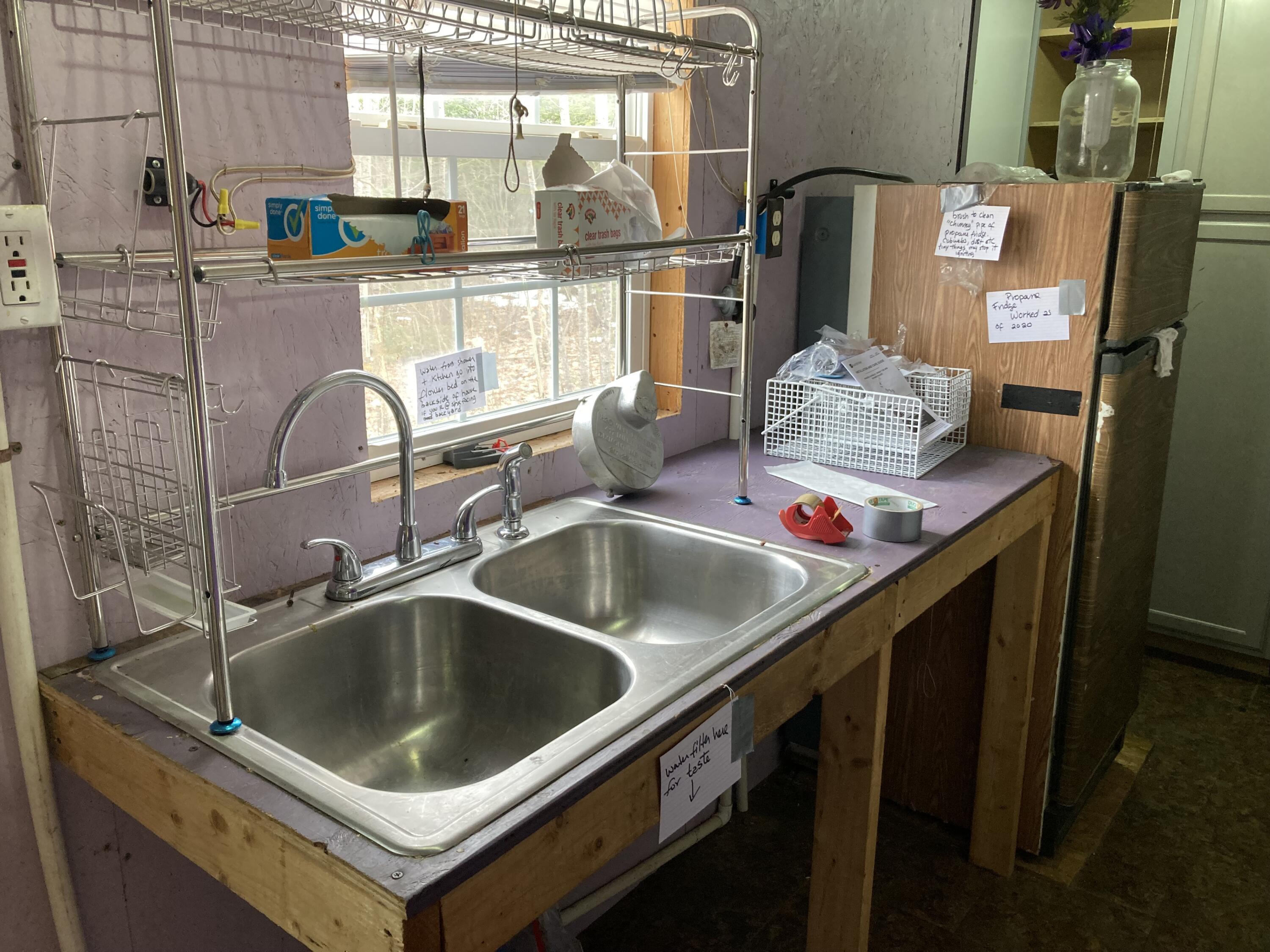 124 Young Lane Burnham, ME 04922 - Photo 8 of 40 Kitchen sink and propane fridge