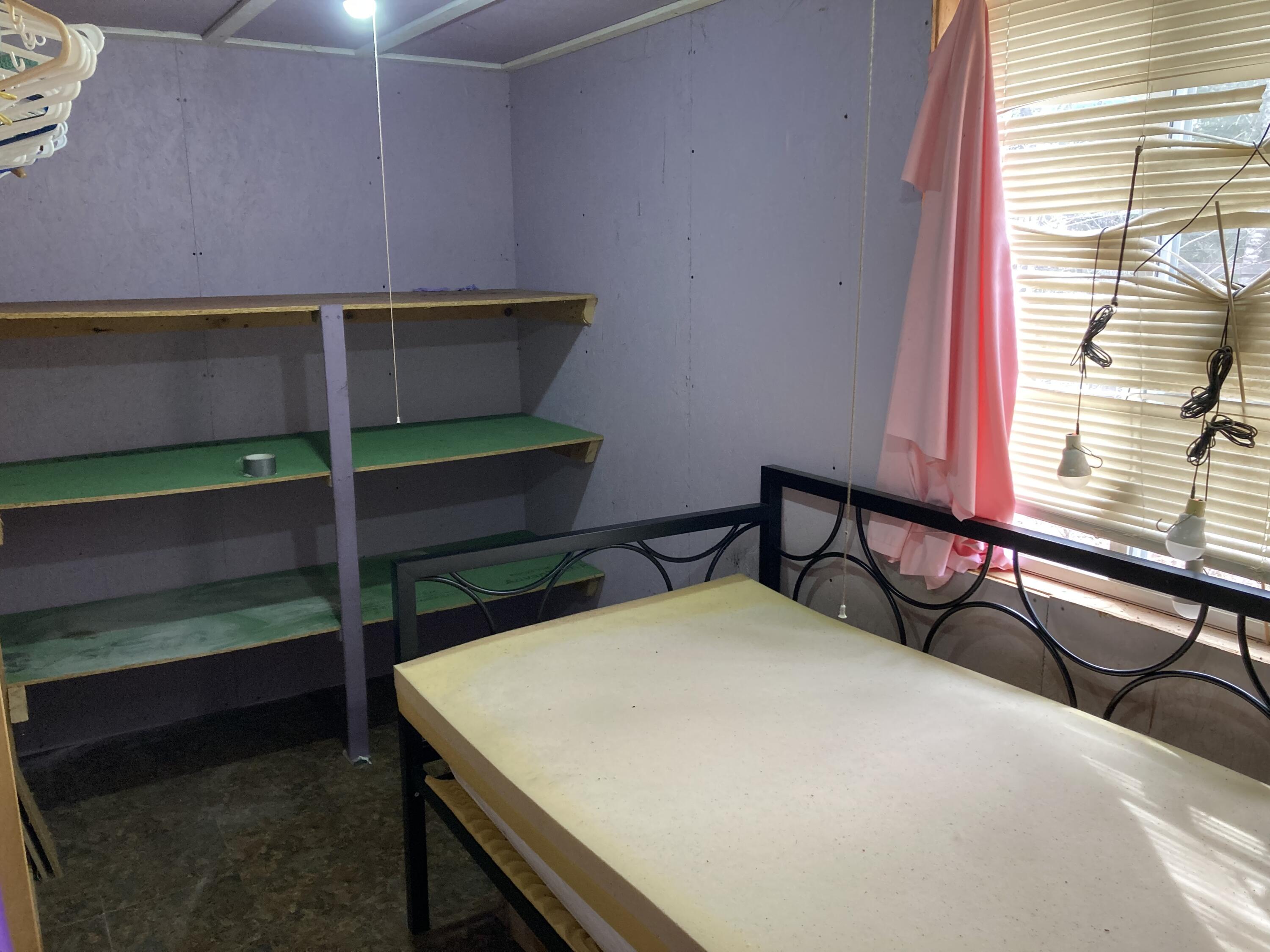 124 Young Lane Burnham, ME 04922 - Photo 9 of 40 bedroom, shower behind bed