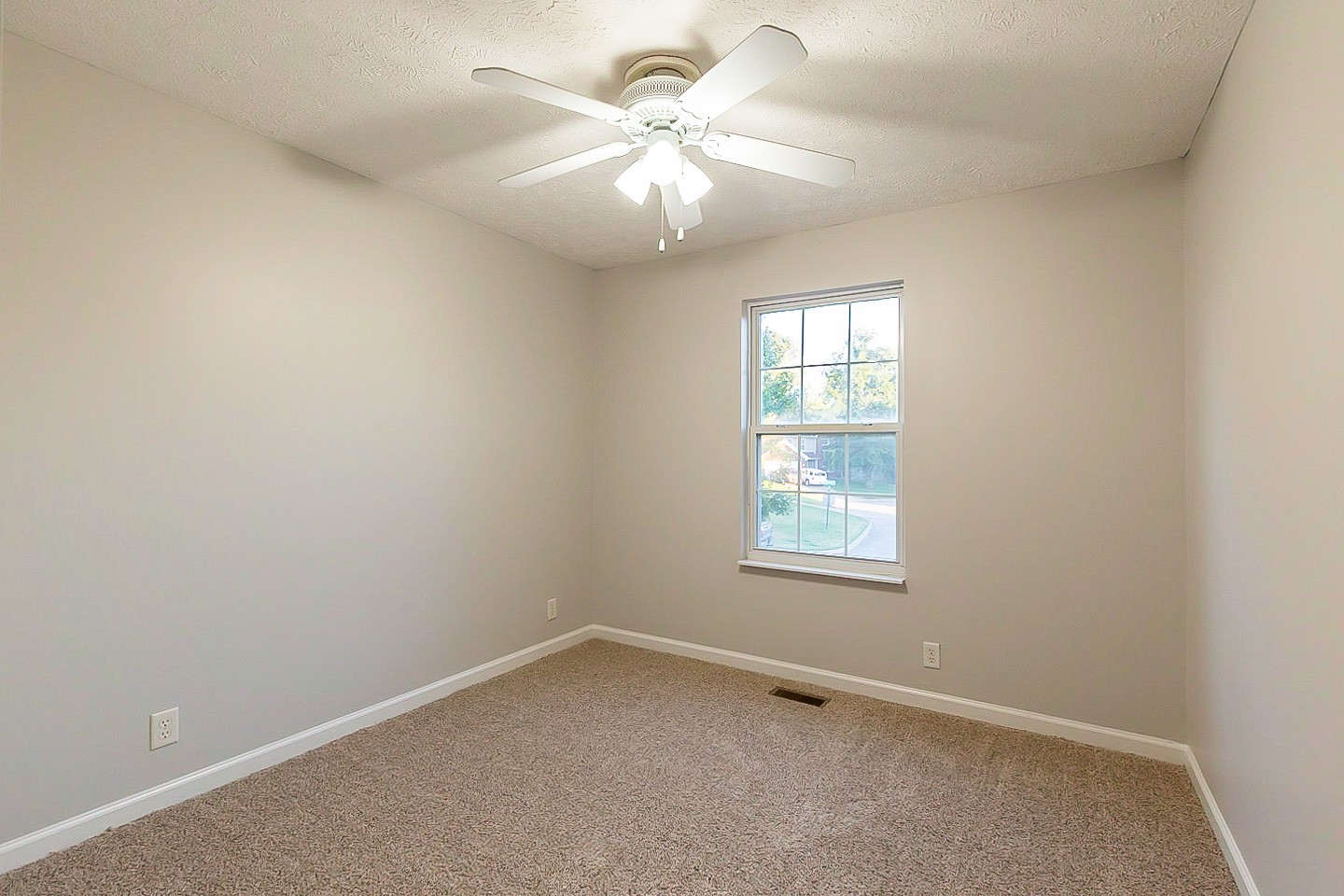 1945 Portway Road Spring Hill, TN 37174 - Photo 16 of 26 an empty room with a window and a fan