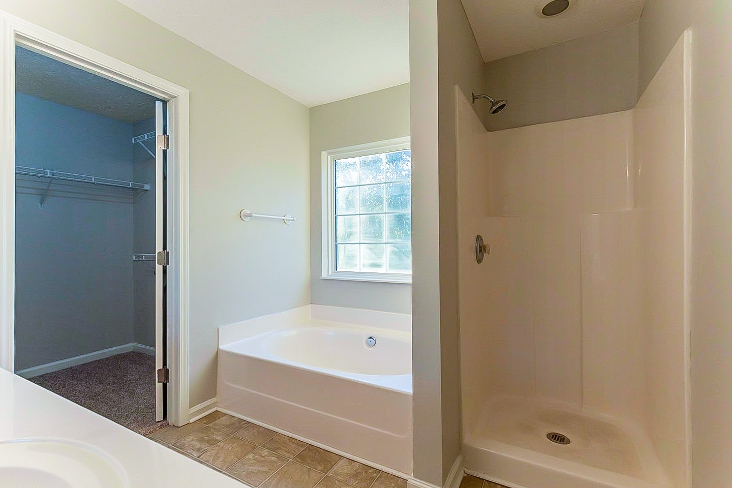 1945 Portway Road Spring Hill, TN 37174 - Photo 23 of 26 a bathroom with a bathtub and a shower