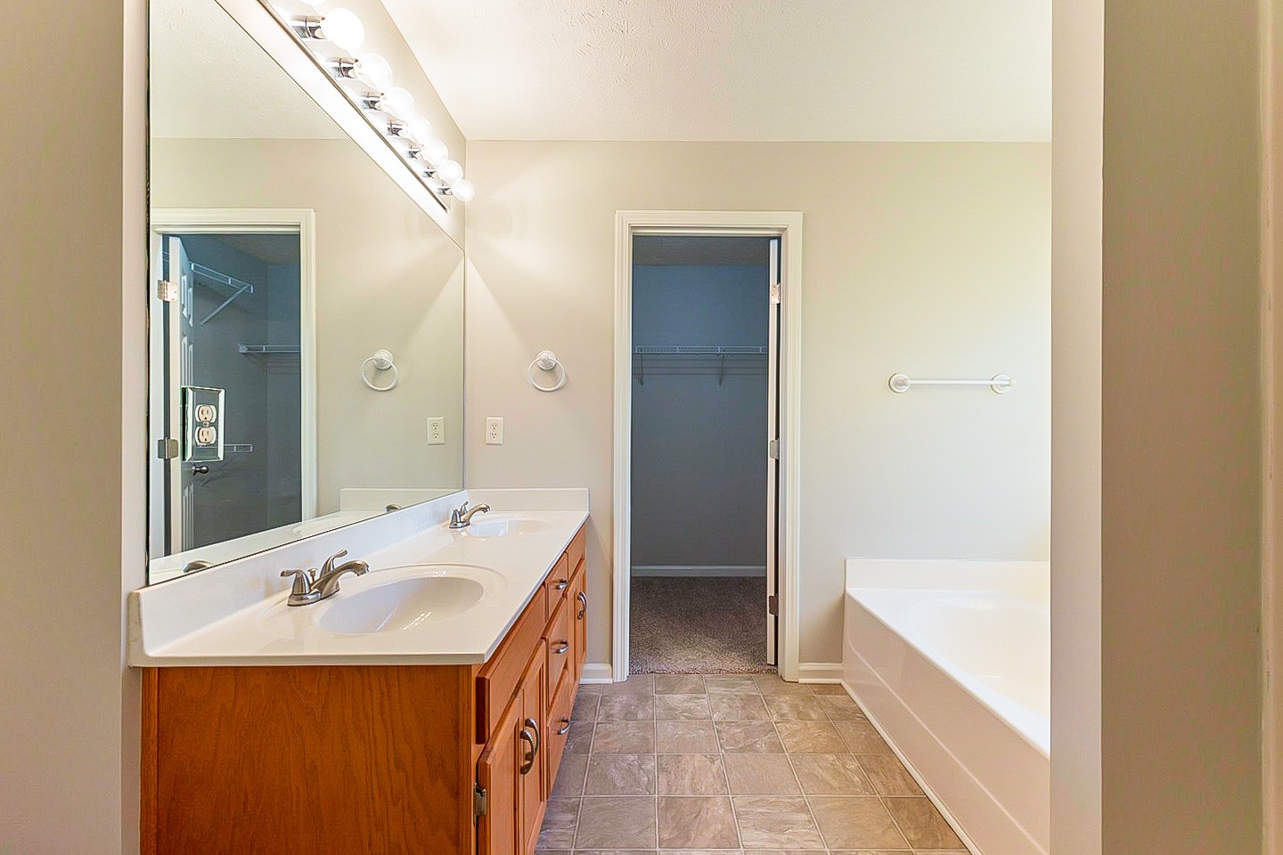 1945 Portway Road Spring Hill, TN 37174 - Photo 6 of 26 a bathroom with a tub sink and mirror