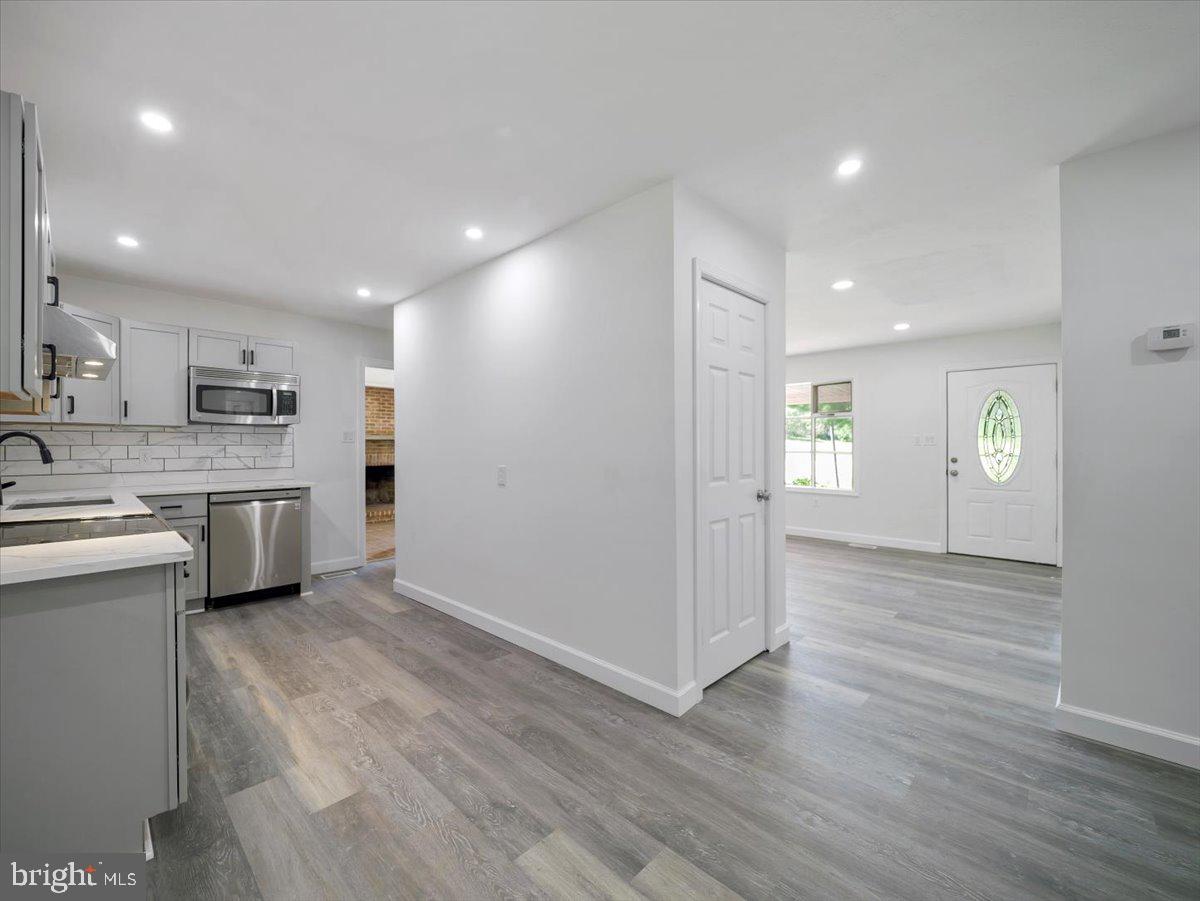 8704 Orndorff Road Thurmont, MD 21788 - Photo 12 of 43 a view of kitchen with cabinets appliances and wooden floor