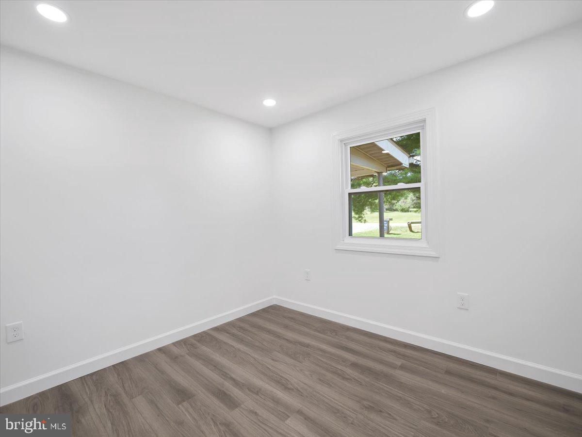 8704 Orndorff Road Thurmont, MD 21788 - Photo 13 of 43 an empty room with wooden floor and a window