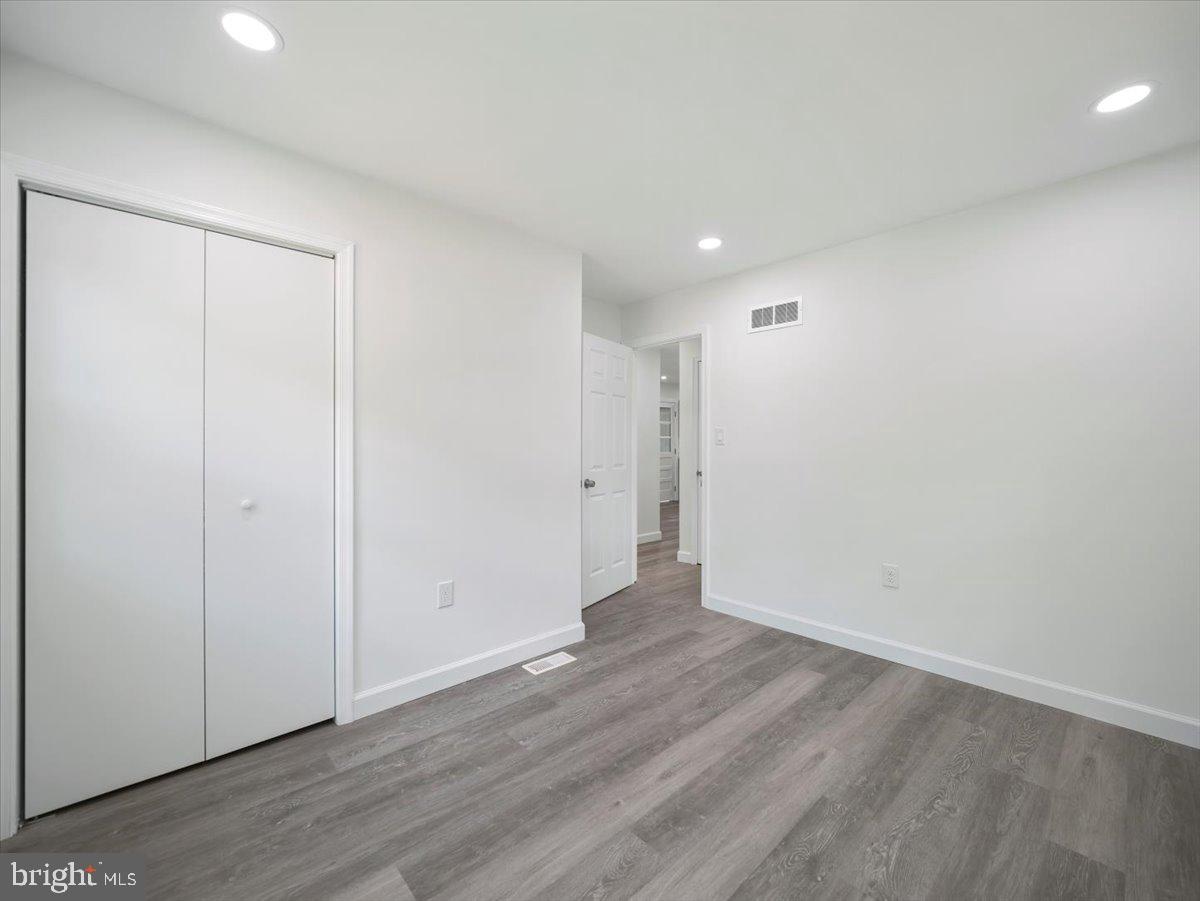 8704 Orndorff Road Thurmont, MD 21788 - Photo 16 of 43 a view of an empty room with wooden floor