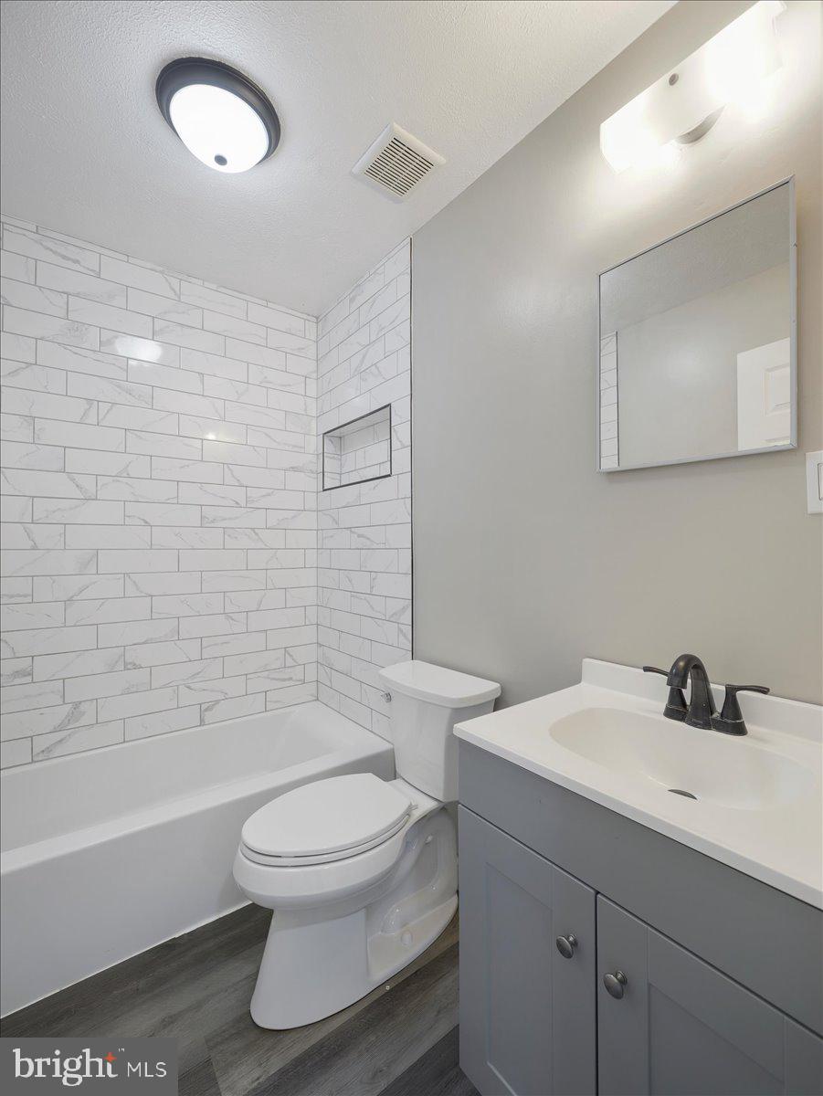 8704 Orndorff Road Thurmont, MD 21788 - Photo 17 of 43 a bathroom with a sink a toilet and shower