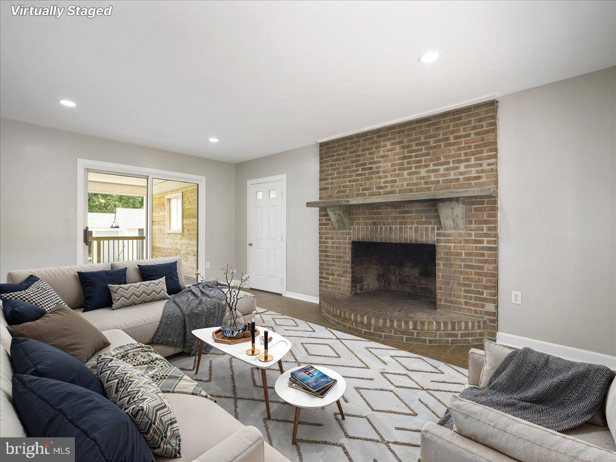 8704 Orndorff Road Thurmont, MD 21788 - Photo 24 of 43 a living room with furniture and a fireplace