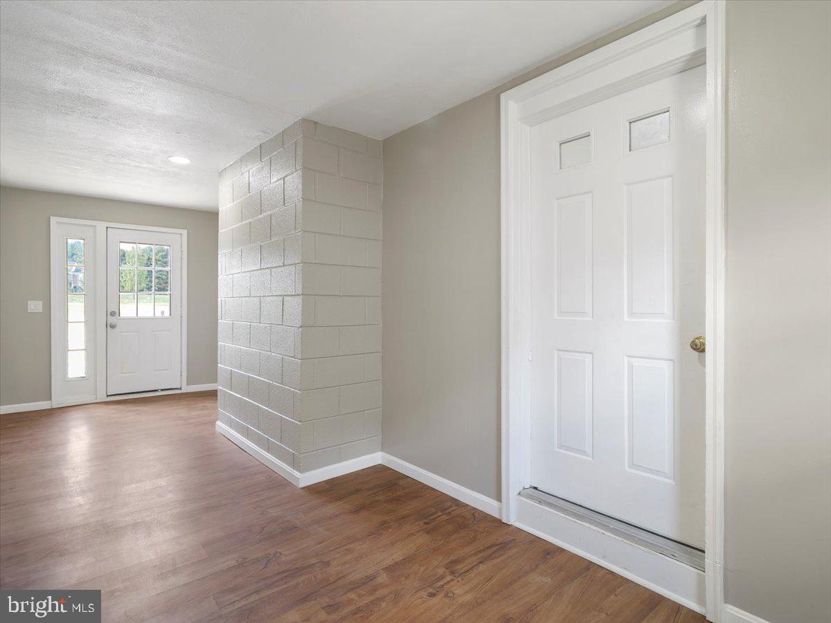 8704 Orndorff Road Thurmont, MD 21788 - Photo 27 of 43 an empty room with wooden floor and windows