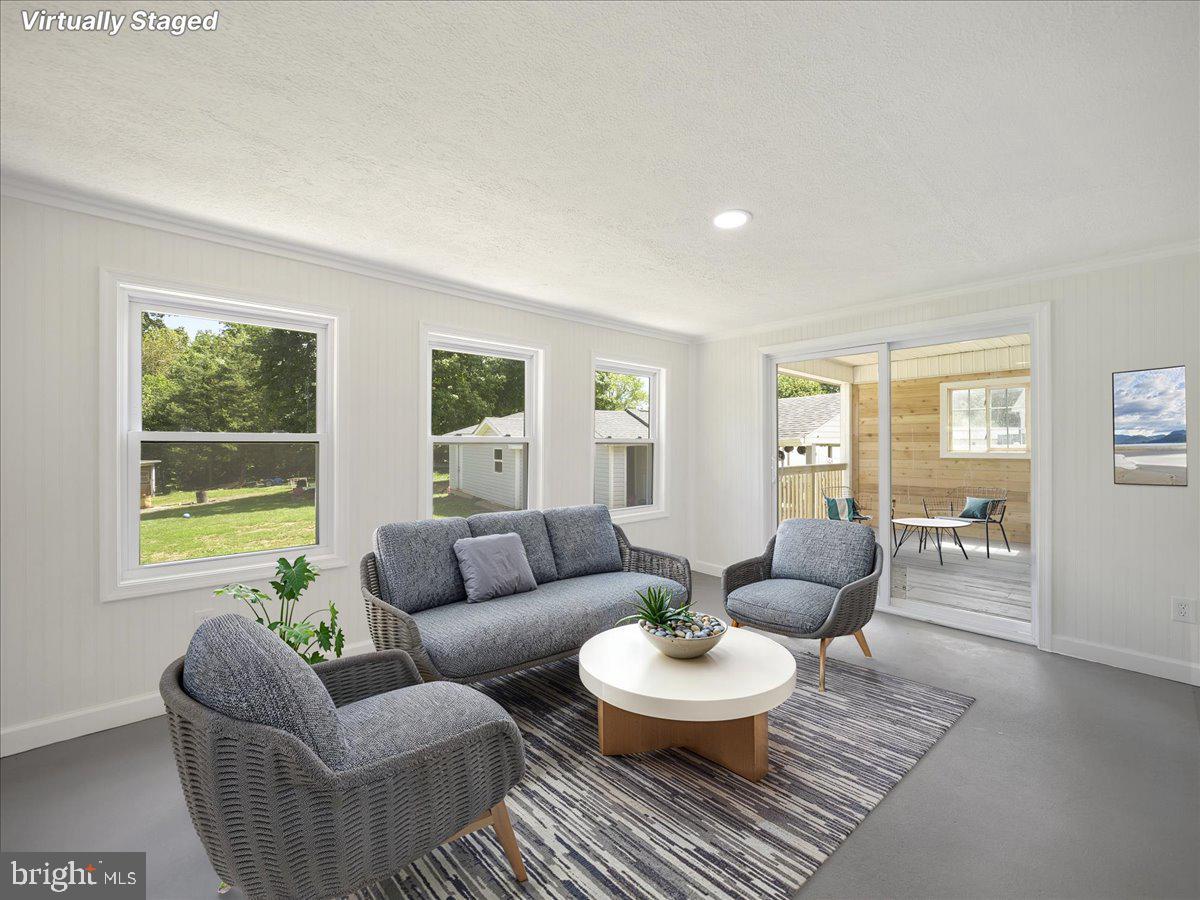 8704 Orndorff Road Thurmont, MD 21788 - Photo 29 of 43 a living room with furniture and a large window