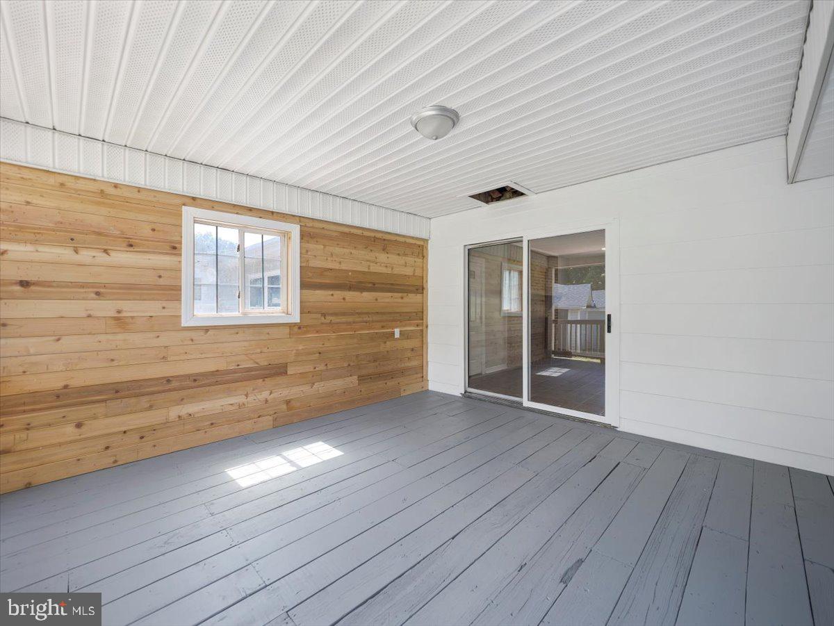 8704 Orndorff Road Thurmont, MD 21788 - Photo 32 of 43 a view of an empty room with wooden floor and a window