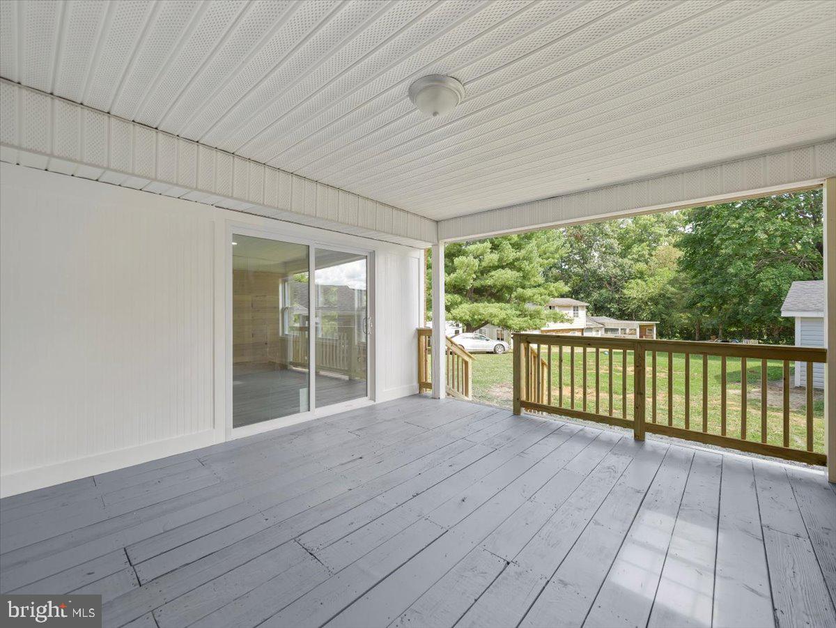 8704 Orndorff Road Thurmont, MD 21788 - Photo 33 of 43 a view of a room with wooden floor and iron stairs