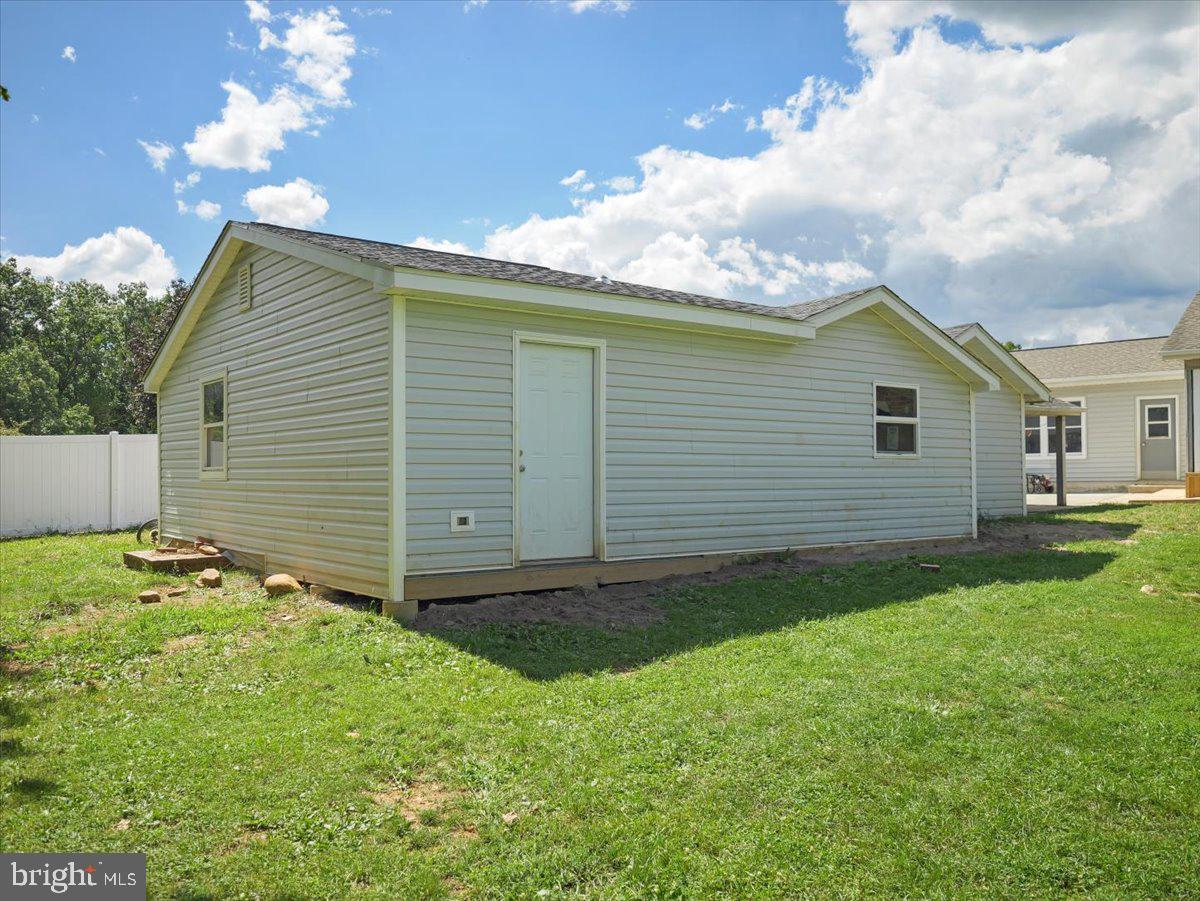 8704 Orndorff Road Thurmont, MD 21788 - Photo 41 of 43 a backyard of a house with table and chairs
