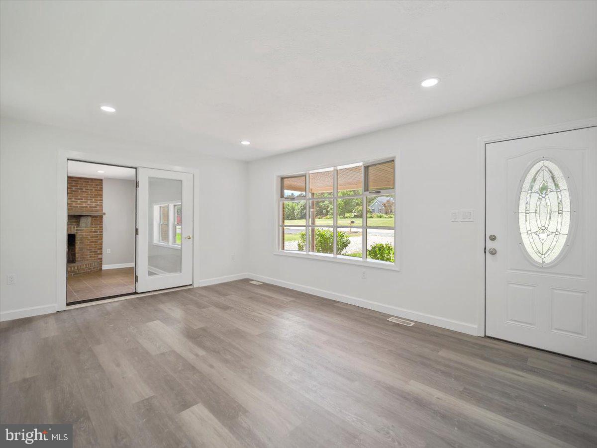 8704 Orndorff Road Thurmont, MD 21788 - Photo 7 of 43 an empty room with wooden floor and window