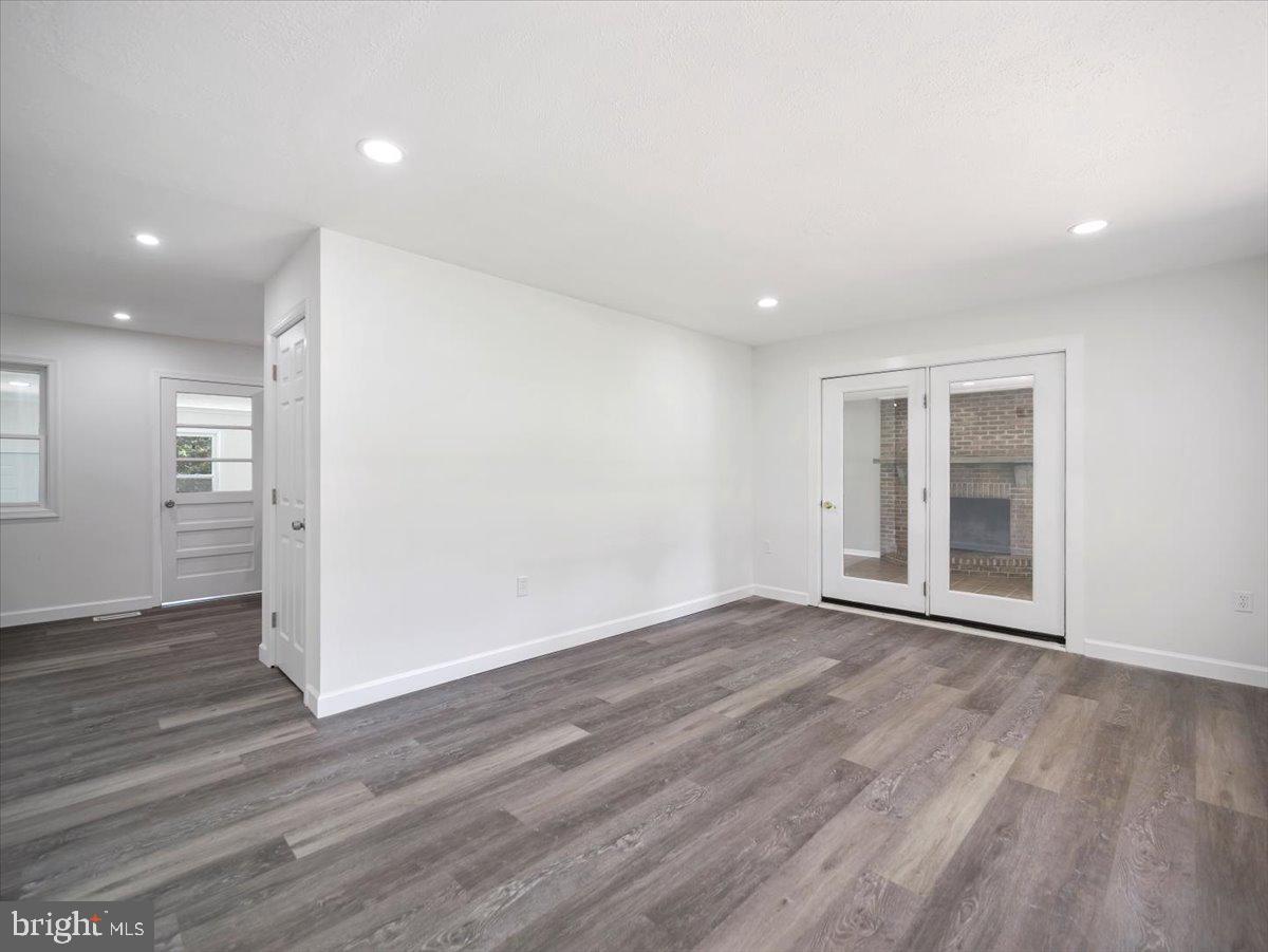 8704 Orndorff Road Thurmont, MD 21788 - Photo 8 of 43 a view of an empty room with wooden floor and a window