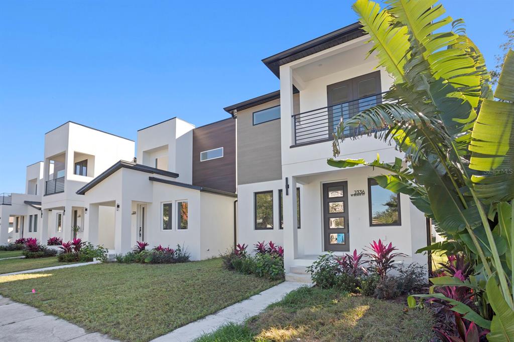 a front view of a house with garden