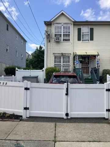 a front view of a house with garage