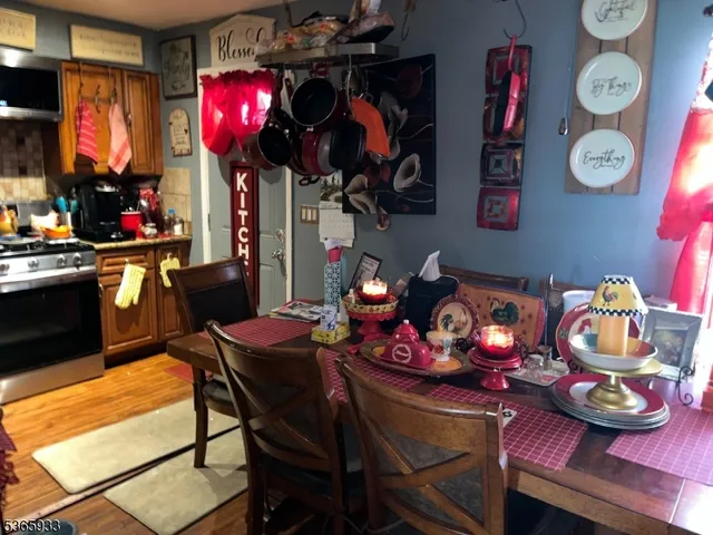 a view of a dining room with furniture and chandelier