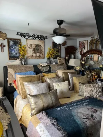 a living room with furniture and a chandelier